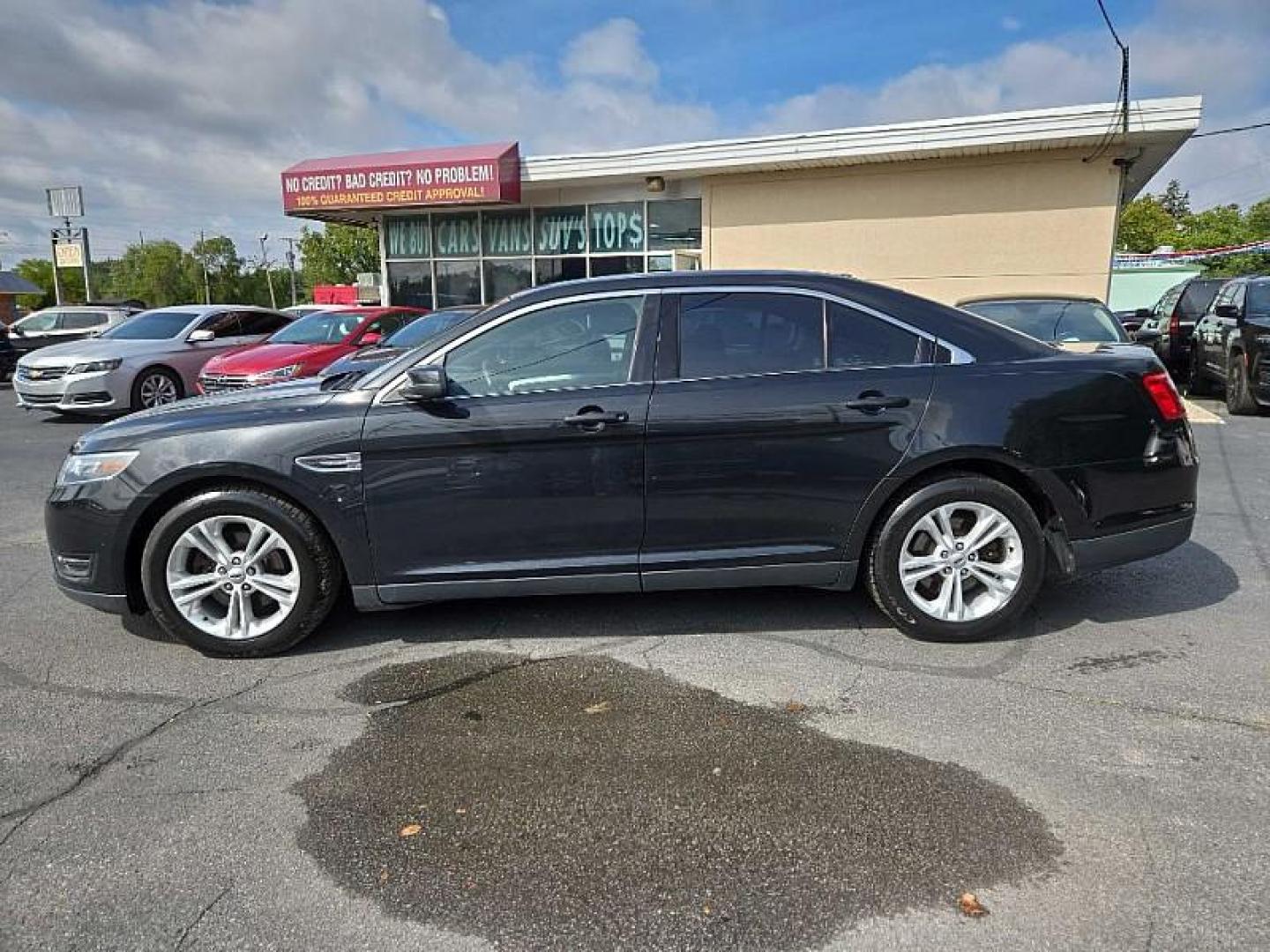 2015 BLACK /BLACK Ford Taurus SEL FWD (1FAHP2E8XFG) with an 3.5L V6 DOHC 24V engine, 6-Speed Automatic transmission, located at 3304 Woodville Road, Northwood, OH, 43619, (419) 210-8019, 41.612694, -83.480743 - We are #1 Auto Loan Dealer for Good Bad or No Credit we have hundreds of vehicles to choose from, stop on in or just fill out our online application to get approved for auto financing and see your credit score for free by visiting our website today. We have Low Payment Options and Terms Available - Photo#1