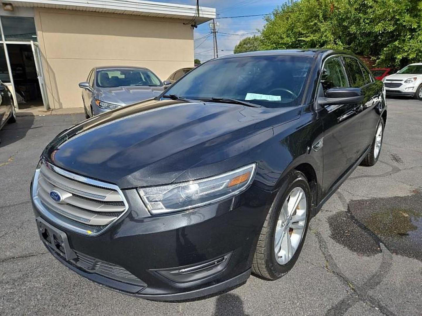 2015 BLACK /BLACK Ford Taurus SEL FWD (1FAHP2E8XFG) with an 3.5L V6 DOHC 24V engine, 6-Speed Automatic transmission, located at 3304 Woodville Road, Northwood, OH, 43619, (419) 210-8019, 41.612694, -83.480743 - We are #1 Auto Loan Dealer for Good Bad or No Credit we have hundreds of vehicles to choose from, stop on in or just fill out our online application to get approved for auto financing and see your credit score for free by visiting our website today. We have Low Payment Options and Terms Available - Photo#0