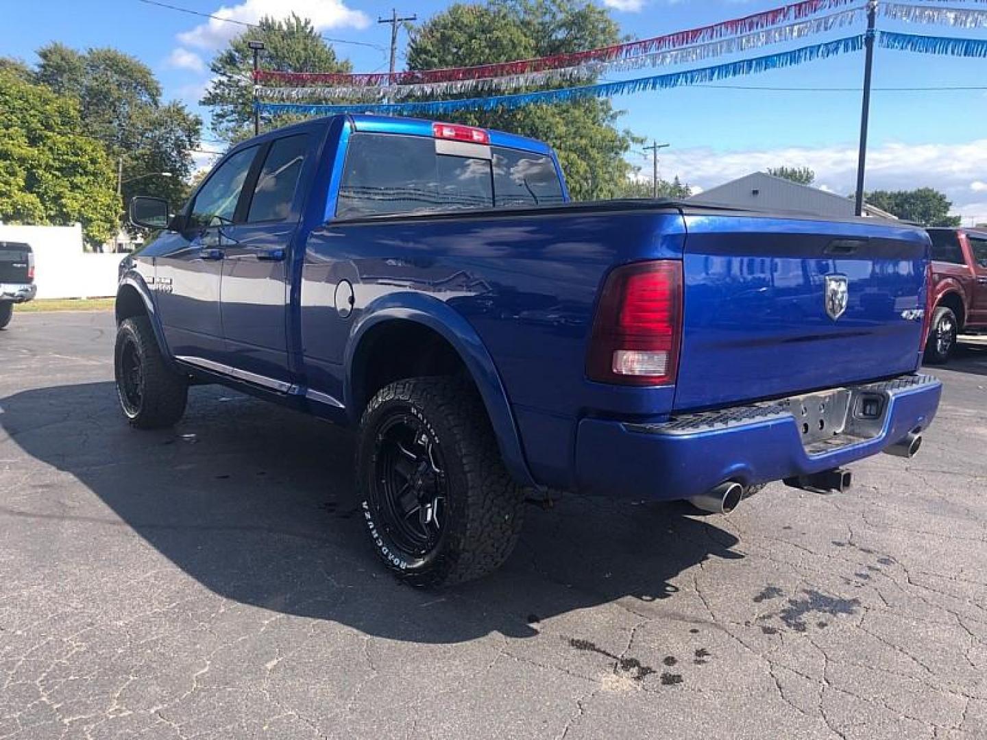 2014 BLUE /BLACK RAM 1500 Sport Quad Cab 4WD (1C6RR7HT9ES) with an 5.7L V8 OHV 16V engine, 6-Speed Automatic transmission, located at 3304 Woodville Road, Northwood, OH, 43619, (419) 210-8019, 41.612694, -83.480743 - We are #1 Auto Loan Dealer for Good Bad or No Credit we have hundreds of vehicles to choose from, stop on in or just fill out our online application to get approved for auto financing and see your credit score for free by visiting our website today. We have Low Payment Options and Terms Available - Photo#2