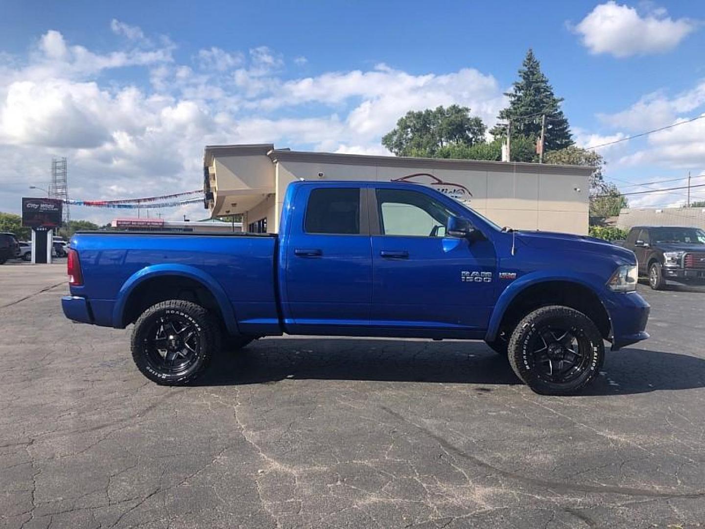 2014 BLUE /BLACK RAM 1500 Sport Quad Cab 4WD (1C6RR7HT9ES) with an 5.7L V8 OHV 16V engine, 6-Speed Automatic transmission, located at 3304 Woodville Road, Northwood, OH, 43619, (419) 210-8019, 41.612694, -83.480743 - We are #1 Auto Loan Dealer for Good Bad or No Credit we have hundreds of vehicles to choose from, stop on in or just fill out our online application to get approved for auto financing and see your credit score for free by visiting our website today. We have Low Payment Options and Terms Available - Photo#5