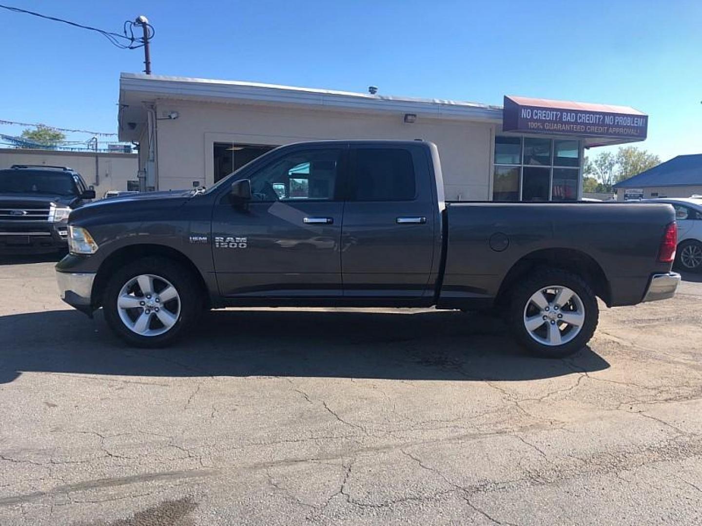 2014 GRAY /GREY RAM 1500 SLT Quad Cab 4WD (1C6RR7GT5ES) with an 5.7L V8 OHV 16V engine, 6-Speed Automatic transmission, located at 3304 Woodville Road, Northwood, OH, 43619, (419) 210-8019, 41.612694, -83.480743 - We are #1 Auto Loan Dealer for Good Bad or No Credit we have hundreds of vehicles to choose from, stop on in or just fill out our online application to get approved for auto financing and see your credit score for free by visiting our website today. We have Low Payment Options and Terms Available - Photo#1