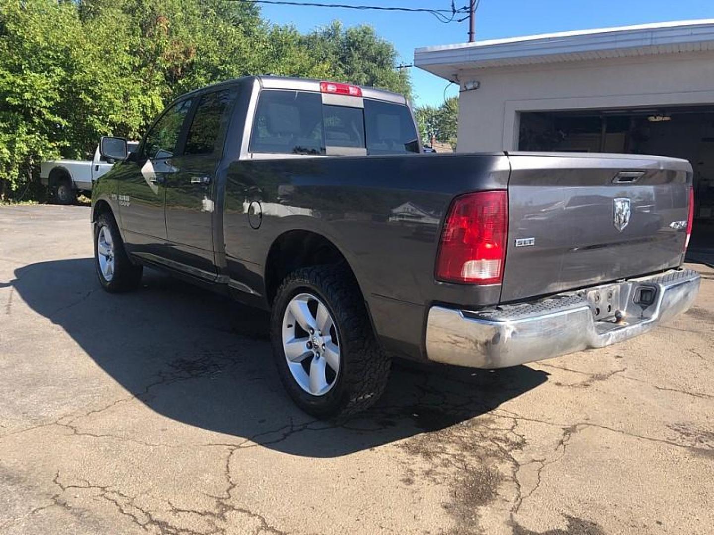 2014 GRAY /GREY RAM 1500 SLT Quad Cab 4WD (1C6RR7GT5ES) with an 5.7L V8 OHV 16V engine, 6-Speed Automatic transmission, located at 3304 Woodville Road, Northwood, OH, 43619, (419) 210-8019, 41.612694, -83.480743 - We are #1 Auto Loan Dealer for Good Bad or No Credit we have hundreds of vehicles to choose from, stop on in or just fill out our online application to get approved for auto financing and see your credit score for free by visiting our website today. We have Low Payment Options and Terms Available - Photo#2