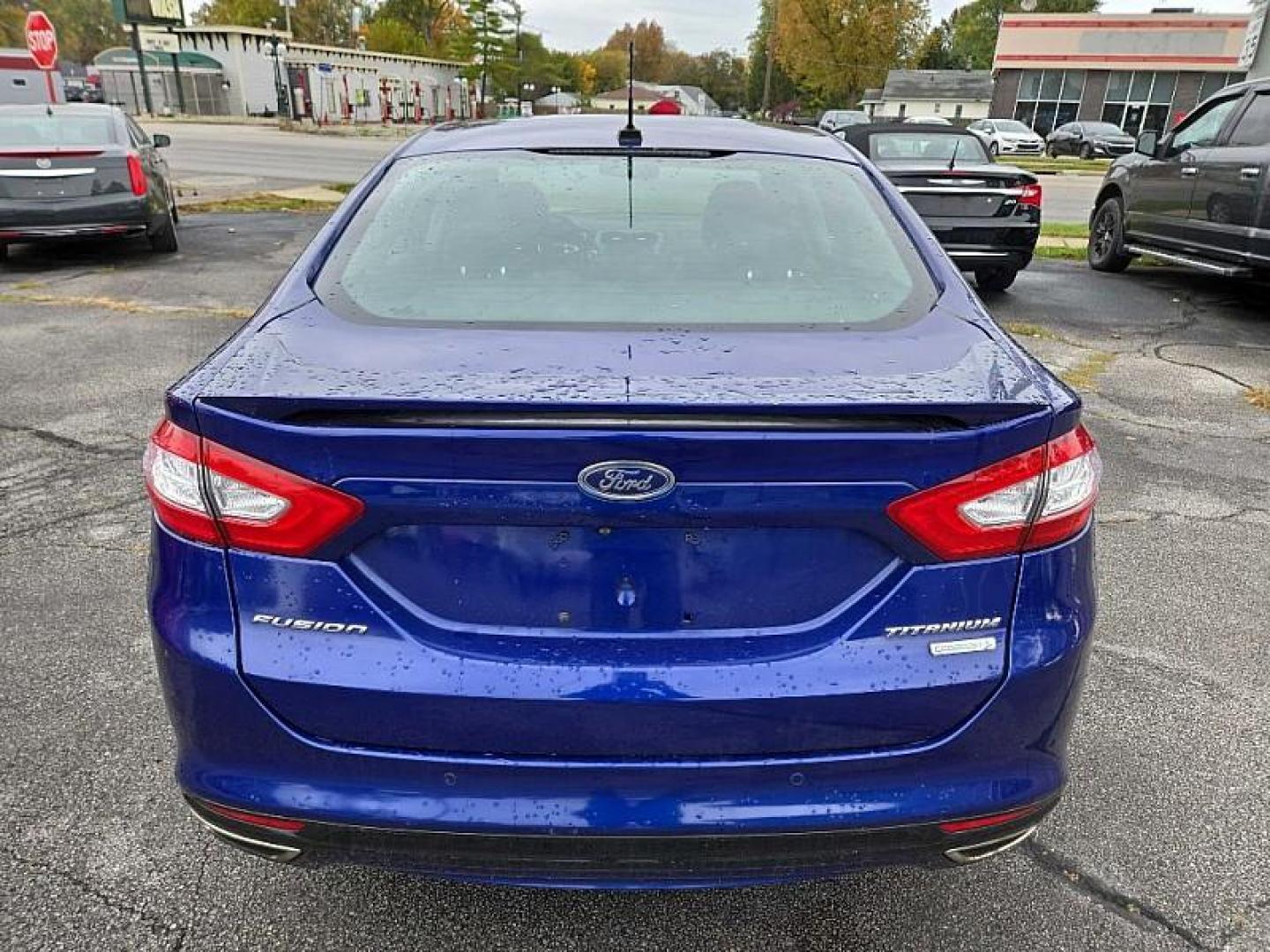 2014 BLUE /BLACK Ford Fusion Titanium (3FA6P0K97ER) with an 2.0L L4 DOHC 16V engine, Automatic 6-Spd transmission, located at 3304 Woodville Road, Northwood, OH, 43619, (419) 210-8019, 41.612694, -83.480743 - We are #1 Auto Loan Dealer for Good Bad or No Credit we have hundreds of vehicles to choose from, stop on in or just fill out our online application to get approved for auto financing and see your credit score for free by visiting our website today. We have Low Payment Options and Terms Available - Photo#32