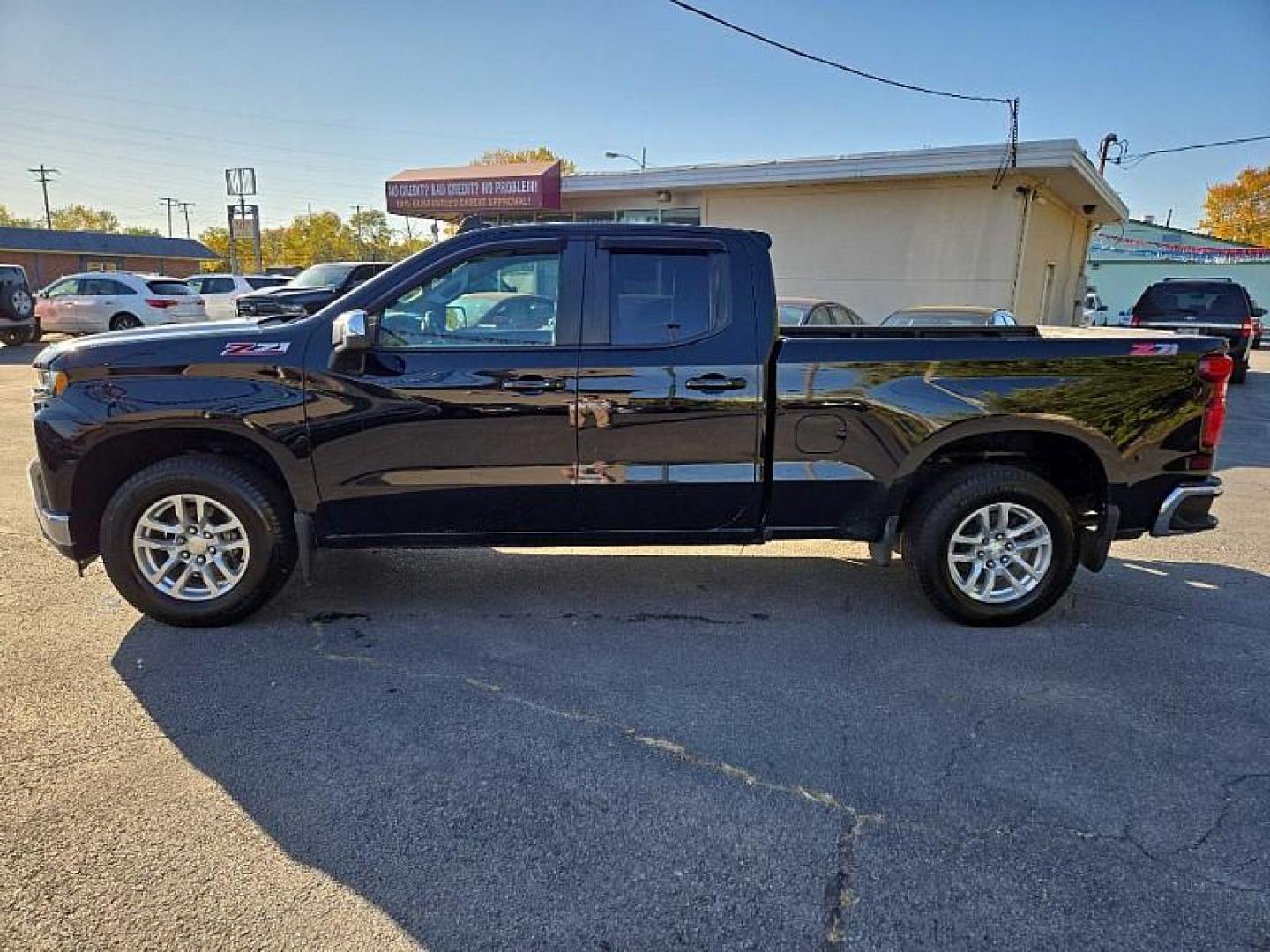 2019 BLACK /BLACK Chevrolet Silverado 1500 LT Double Cab 4WD (1GCRYDED8KZ) with an 5.3L V8 OHV 16V engine, 6A transmission, located at 3304 Woodville Road, Northwood, OH, 43619, (419) 210-8019, 41.612694, -83.480743 - We are #1 Auto Loan Dealer for Good Bad or No Credit we have hundreds of vehicles to choose from, stop on in or just fill out our online application to get approved for auto financing and see your credit score for free by visiting our website today. We have Low Payment Options and Terms Available - Photo#2