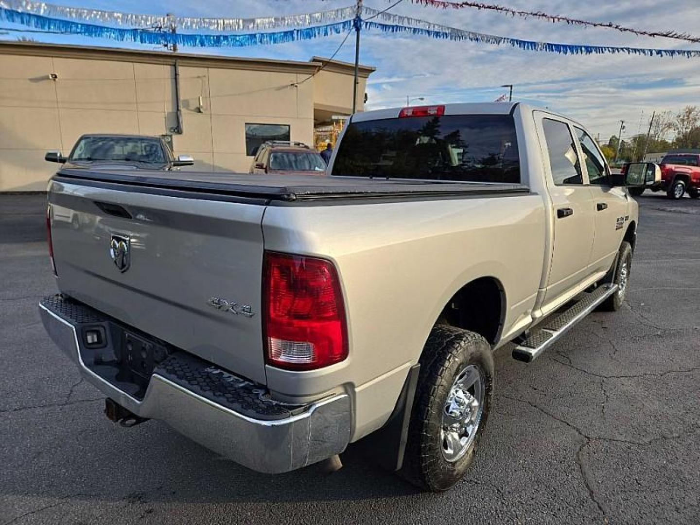 2013 SILVER /GREY RAM 2500 Tradesman Crew Cab SWB 4WD (3C6TR5CT4DG) with an 5.7L V8 OHV 16V engine, 6-Speed Automatic transmission, located at 3304 Woodville Road, Northwood, OH, 43619, (419) 210-8019, 41.612694, -83.480743 - Your #1 Destination for Auto Loans and mdash;No Matter Your Credit!At our dealership, we cater to everyone and mdash;whether you have good, bad, or no credit. With hundreds of vehicles to choose from, you can easily find the perfect car, truck, or SUV that fits your needs.Get Approved Today!Visit ou - Photo#4