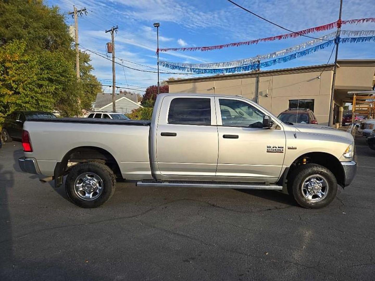 2013 SILVER /GREY RAM 2500 Tradesman Crew Cab SWB 4WD (3C6TR5CT4DG) with an 5.7L V8 OHV 16V engine, 6-Speed Automatic transmission, located at 3304 Woodville Road, Northwood, OH, 43619, (419) 210-8019, 41.612694, -83.480743 - Your #1 Destination for Auto Loans and mdash;No Matter Your Credit!At our dealership, we cater to everyone and mdash;whether you have good, bad, or no credit. With hundreds of vehicles to choose from, you can easily find the perfect car, truck, or SUV that fits your needs.Get Approved Today!Visit ou - Photo#5