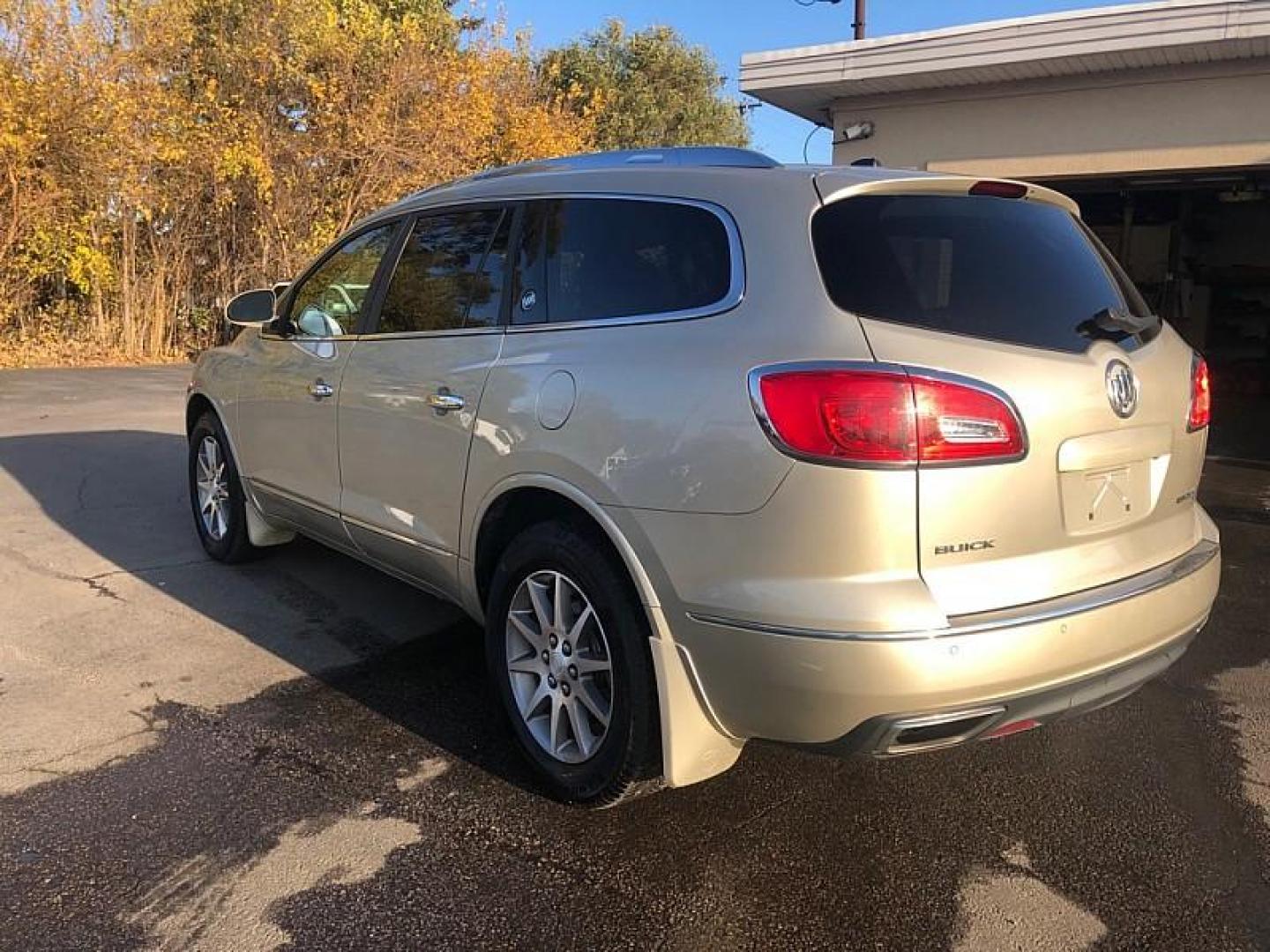 2015 TAN /BLACK Buick Enclave Leather AWD (5GAKVBKD5FJ) with an 3.6L V6 DOHC 24V engine, 6-Speed Automatic Overdrive transmission, located at 3304 Woodville Road, Northwood, OH, 43619, (419) 210-8019, 41.612694, -83.480743 - Your #1 Destination for Auto Loans and mdash;No Matter Your Credit!At our dealership, we cater to everyone and mdash;whether you have good, bad, or no credit. With hundreds of vehicles to choose from, you can easily find the perfect car, truck, or SUV that fits your needs.Get Approved Today!Visit ou - Photo#2