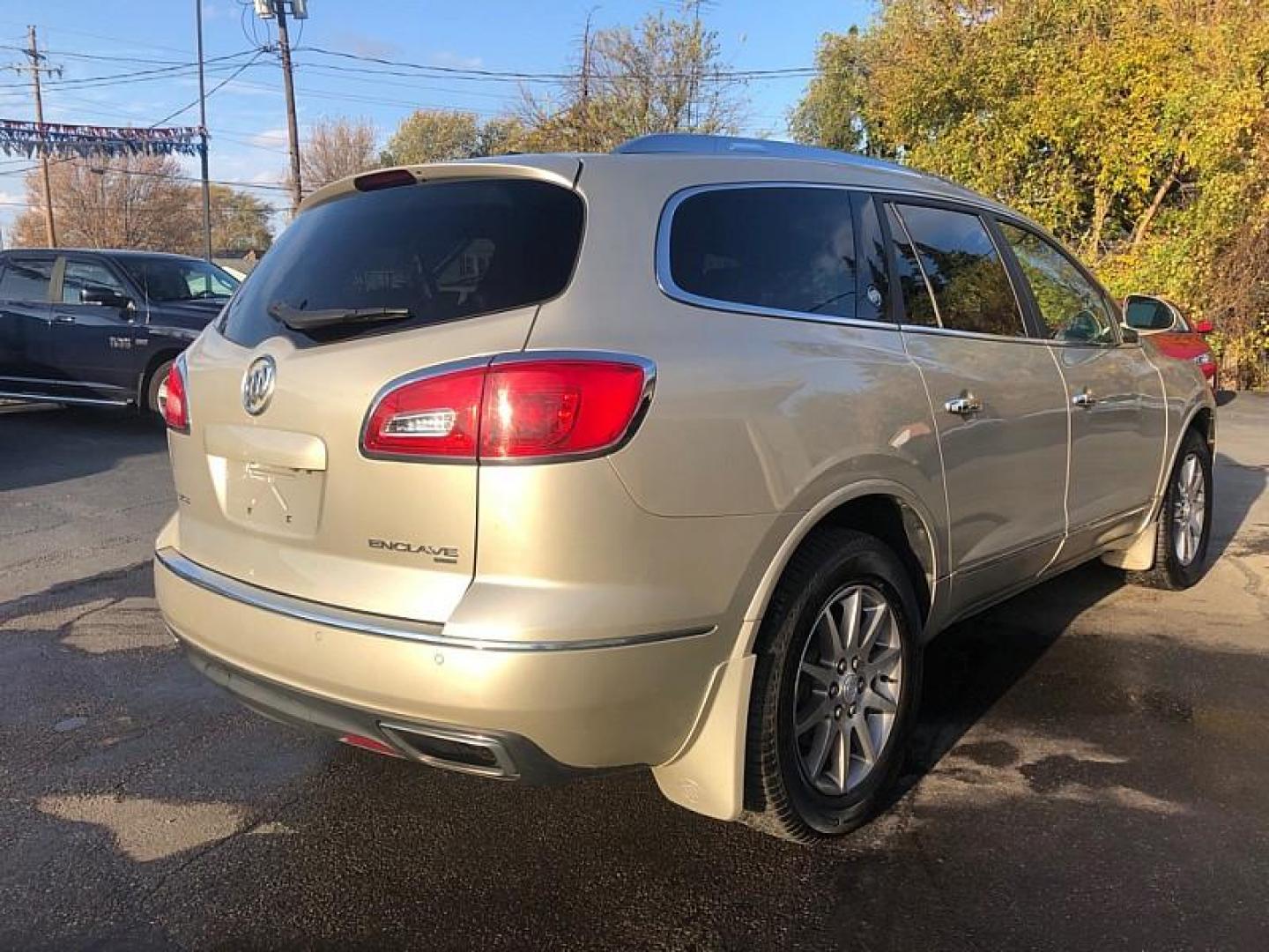 2015 TAN /BLACK Buick Enclave Leather AWD (5GAKVBKD5FJ) with an 3.6L V6 DOHC 24V engine, 6-Speed Automatic Overdrive transmission, located at 3304 Woodville Road, Northwood, OH, 43619, (419) 210-8019, 41.612694, -83.480743 - Your #1 Destination for Auto Loans and mdash;No Matter Your Credit!At our dealership, we cater to everyone and mdash;whether you have good, bad, or no credit. With hundreds of vehicles to choose from, you can easily find the perfect car, truck, or SUV that fits your needs.Get Approved Today!Visit ou - Photo#4