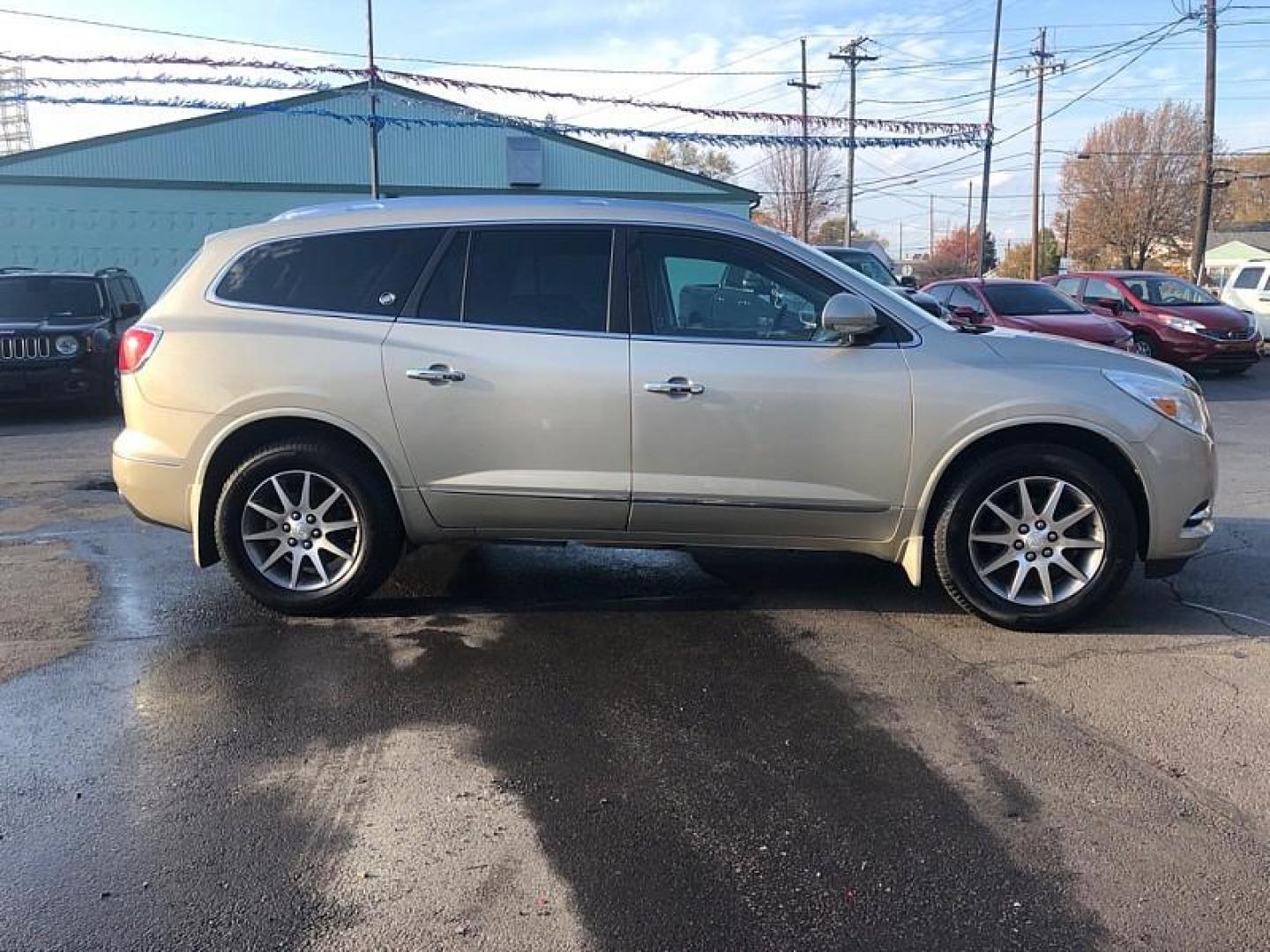 2015 TAN /BLACK Buick Enclave Leather AWD (5GAKVBKD5FJ) with an 3.6L V6 DOHC 24V engine, 6-Speed Automatic Overdrive transmission, located at 3304 Woodville Road, Northwood, OH, 43619, (419) 210-8019, 41.612694, -83.480743 - Your #1 Destination for Auto Loans and mdash;No Matter Your Credit!At our dealership, we cater to everyone and mdash;whether you have good, bad, or no credit. With hundreds of vehicles to choose from, you can easily find the perfect car, truck, or SUV that fits your needs.Get Approved Today!Visit ou - Photo#5