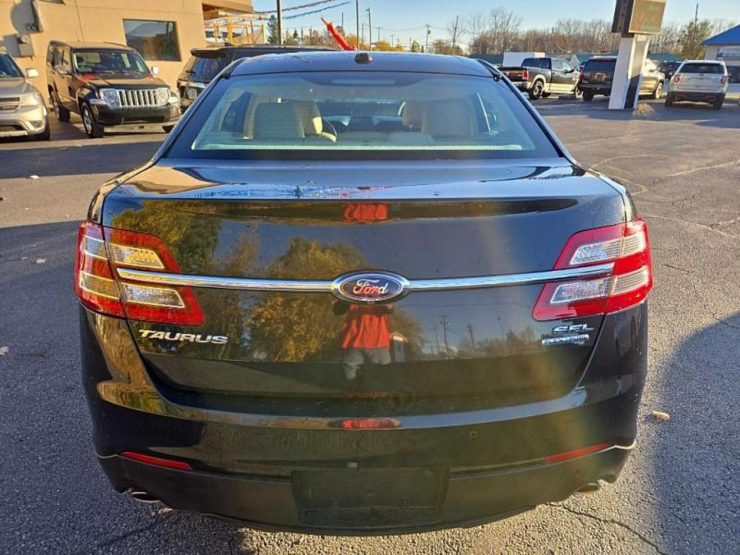 2014 BLACK /TAN Ford Taurus SEL FWD (1FAHP2E86EG) with an 3.5L V6 DOHC 24V engine, 6-Speed Automatic transmission, located at 3304 Woodville Road, Northwood, OH, 43619, (419) 210-8019, 41.612694, -83.480743 - Your #1 Destination for Auto Loans and mdash;No Matter Your Credit!At our dealership, we cater to everyone and mdash;whether you have good, bad, or no credit. With hundreds of vehicles to choose from, you can easily find the perfect car, truck, or SUV that fits your needs.Get Approved Today!Visit ou - Photo#3