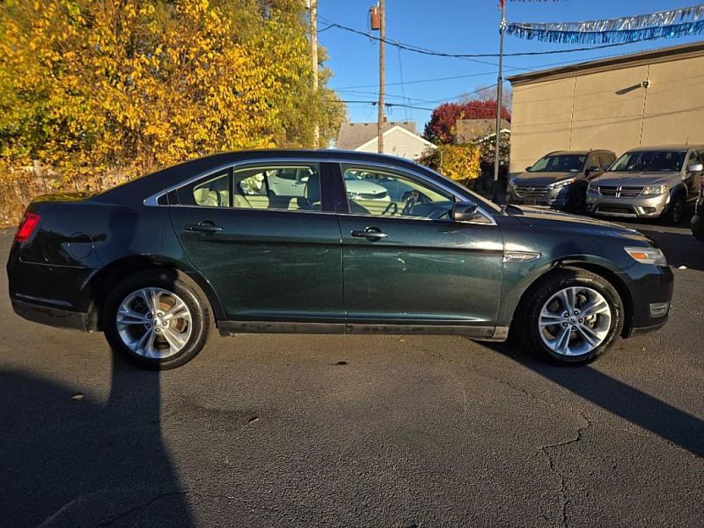 2014 BLACK /TAN Ford Taurus SEL FWD (1FAHP2E86EG) with an 3.5L V6 DOHC 24V engine, 6-Speed Automatic transmission, located at 3304 Woodville Road, Northwood, OH, 43619, (419) 210-8019, 41.612694, -83.480743 - Your #1 Destination for Auto Loans and mdash;No Matter Your Credit!At our dealership, we cater to everyone and mdash;whether you have good, bad, or no credit. With hundreds of vehicles to choose from, you can easily find the perfect car, truck, or SUV that fits your needs.Get Approved Today!Visit ou - Photo#5