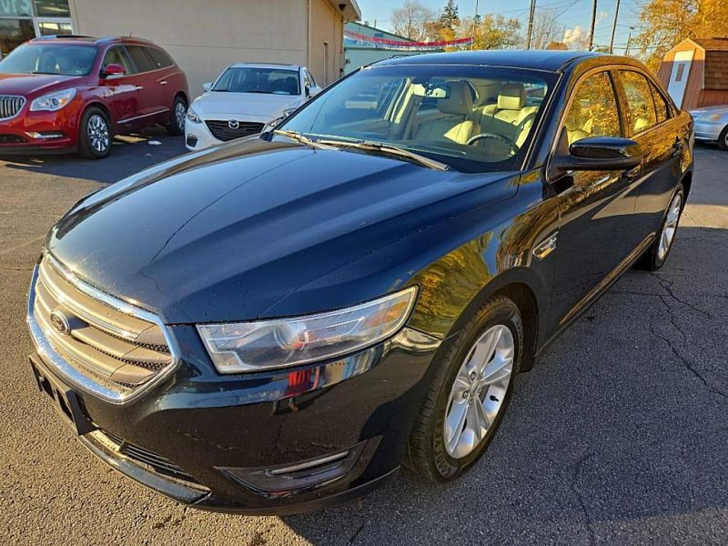 2014 BLACK /TAN Ford Taurus SEL FWD (1FAHP2E86EG) with an 3.5L V6 DOHC 24V engine, 6-Speed Automatic transmission, located at 3304 Woodville Road, Northwood, OH, 43619, (419) 210-8019, 41.612694, -83.480743 - Your #1 Destination for Auto Loans and mdash;No Matter Your Credit!At our dealership, we cater to everyone and mdash;whether you have good, bad, or no credit. With hundreds of vehicles to choose from, you can easily find the perfect car, truck, or SUV that fits your needs.Get Approved Today!Visit ou - Photo#0