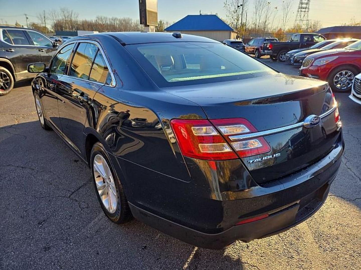 2014 BLACK /TAN Ford Taurus SEL FWD (1FAHP2E86EG) with an 3.5L V6 DOHC 24V engine, 6-Speed Automatic transmission, located at 3304 Woodville Road, Northwood, OH, 43619, (419) 210-8019, 41.612694, -83.480743 - Your #1 Destination for Auto Loans and mdash;No Matter Your Credit!At our dealership, we cater to everyone and mdash;whether you have good, bad, or no credit. With hundreds of vehicles to choose from, you can easily find the perfect car, truck, or SUV that fits your needs.Get Approved Today!Visit ou - Photo#2