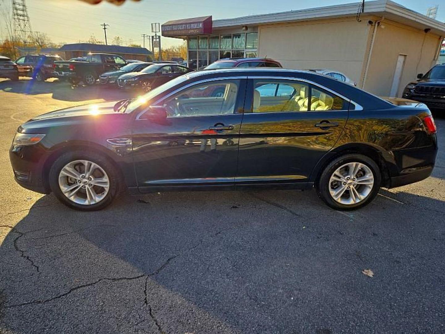 2014 BLACK /TAN Ford Taurus SEL FWD (1FAHP2E86EG) with an 3.5L V6 DOHC 24V engine, 6-Speed Automatic transmission, located at 3304 Woodville Road, Northwood, OH, 43619, (419) 210-8019, 41.612694, -83.480743 - Your #1 Destination for Auto Loans and mdash;No Matter Your Credit!At our dealership, we cater to everyone and mdash;whether you have good, bad, or no credit. With hundreds of vehicles to choose from, you can easily find the perfect car, truck, or SUV that fits your needs.Get Approved Today!Visit ou - Photo#1