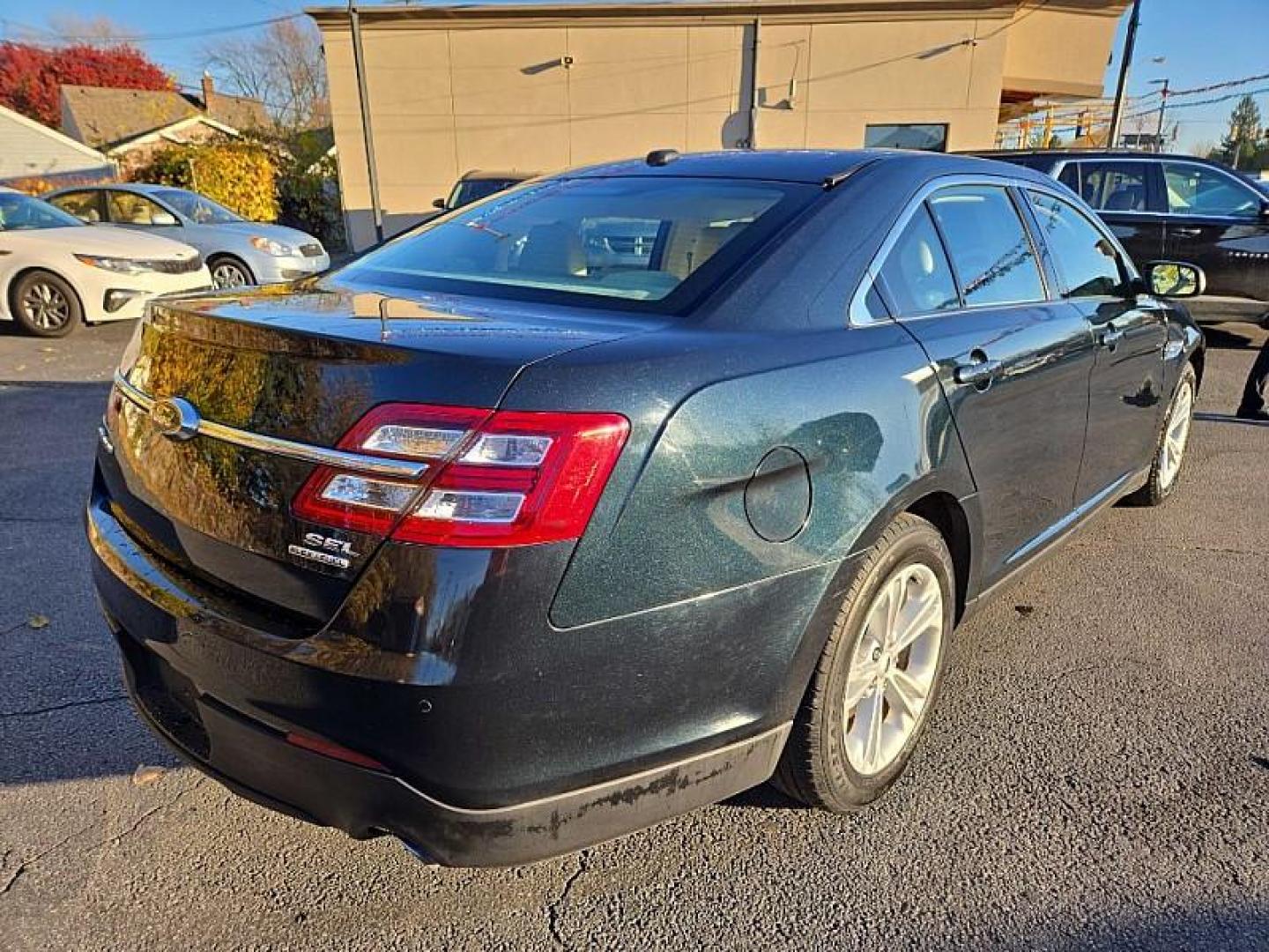 2014 BLACK /TAN Ford Taurus SEL FWD (1FAHP2E86EG) with an 3.5L V6 DOHC 24V engine, 6-Speed Automatic transmission, located at 3304 Woodville Road, Northwood, OH, 43619, (419) 210-8019, 41.612694, -83.480743 - Your #1 Destination for Auto Loans and mdash;No Matter Your Credit!At our dealership, we cater to everyone and mdash;whether you have good, bad, or no credit. With hundreds of vehicles to choose from, you can easily find the perfect car, truck, or SUV that fits your needs.Get Approved Today!Visit ou - Photo#4