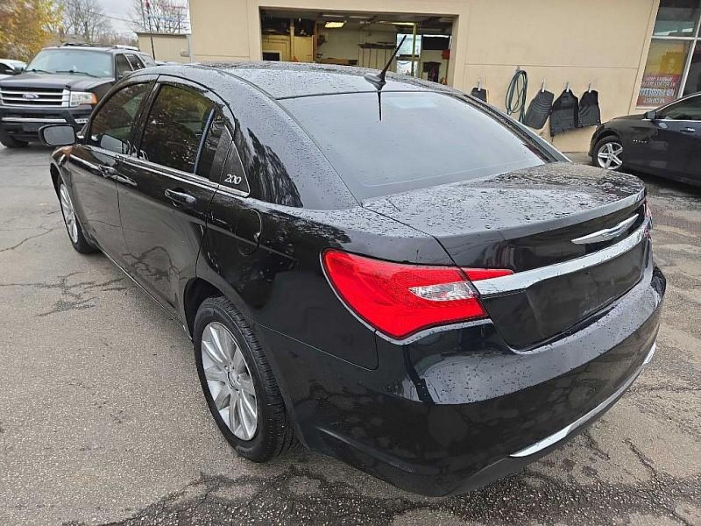 2012 BLACK /BLACK Chrysler 200 Touring (1C3CCBBB7CN) with an 2.4L L4 DOHC 16V engine, 6-Speed Automatic transmission, located at 3304 Woodville Road, Northwood, OH, 43619, (419) 210-8019, 41.612694, -83.480743 - Your #1 Destination for Auto Loans and mdash;No Matter Your Credit!At our dealership, we cater to everyone and mdash;whether you have good, bad, or no credit. With hundreds of vehicles to choose from, you can easily find the perfect car, truck, or SUV that fits your needs.Get Approved Today!Visit ou - Photo#2