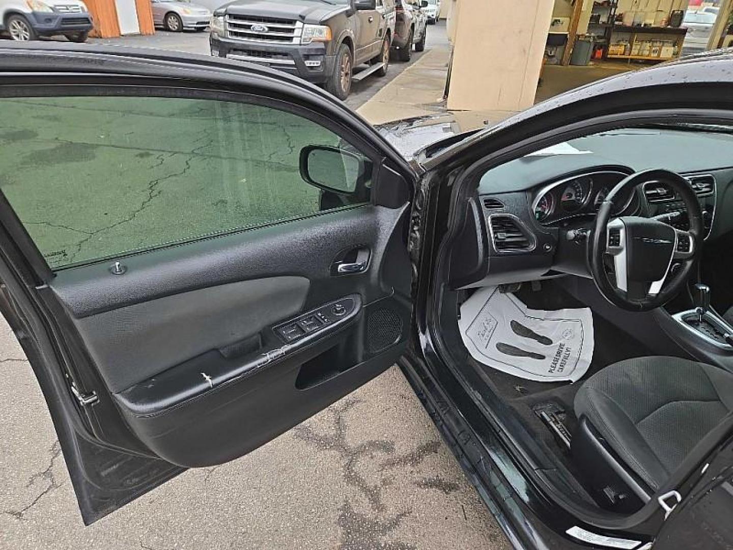 2012 BLACK /BLACK Chrysler 200 Touring (1C3CCBBB7CN) with an 2.4L L4 DOHC 16V engine, 6-Speed Automatic transmission, located at 3304 Woodville Road, Northwood, OH, 43619, (419) 210-8019, 41.612694, -83.480743 - Your #1 Destination for Auto Loans and mdash;No Matter Your Credit!At our dealership, we cater to everyone and mdash;whether you have good, bad, or no credit. With hundreds of vehicles to choose from, you can easily find the perfect car, truck, or SUV that fits your needs.Get Approved Today!Visit ou - Photo#8