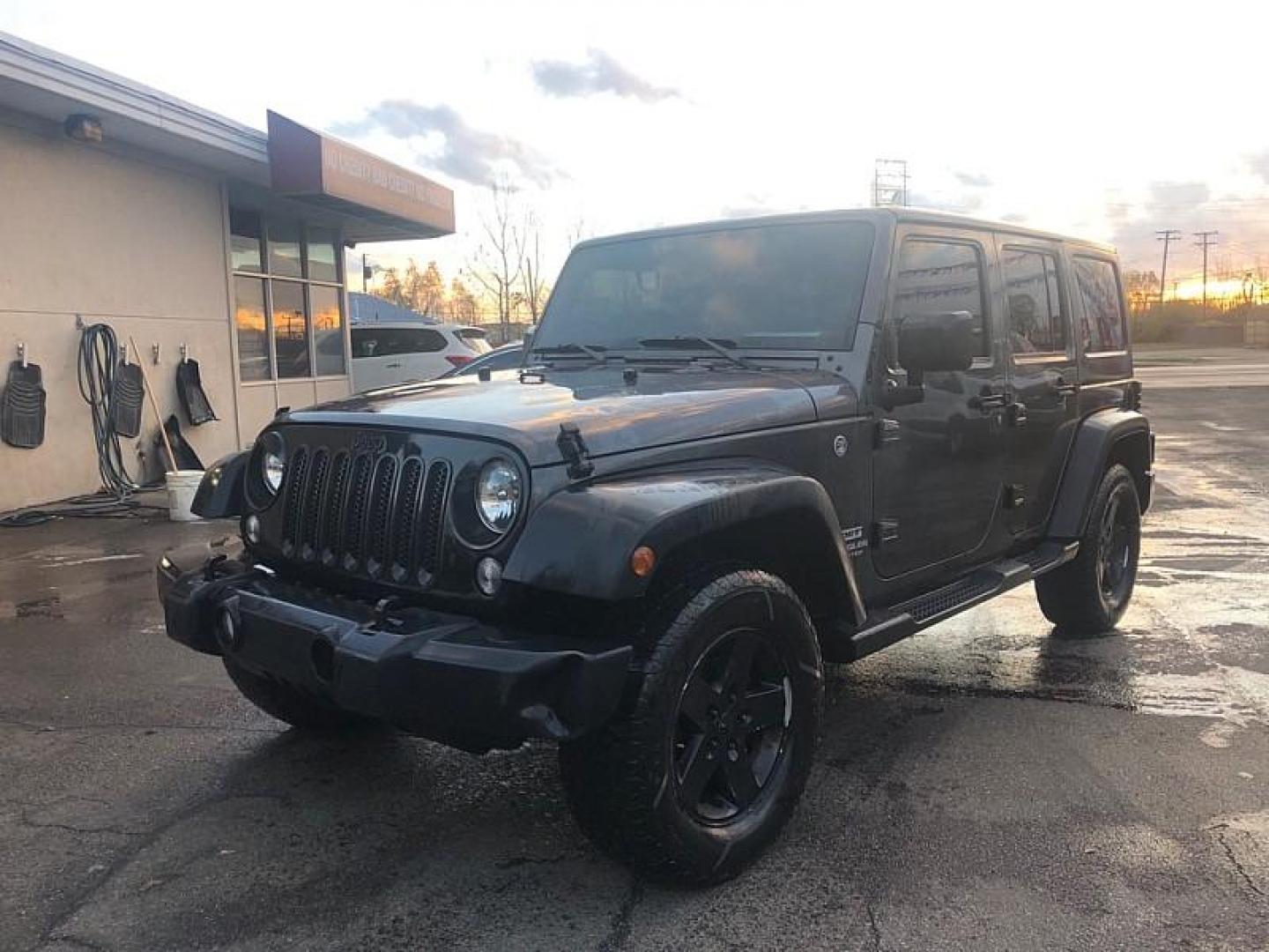 2016 GREY /BLACK Jeep Wrangler Unlimited Sport 4WD (1C4BJWDG1GL) with an 3.6L V6 DOHC 24V FFV engine, Manual 6-Spd transmission, located at 3304 Woodville Road, Northwood, OH, 43619, (419) 210-8019, 41.612694, -83.480743 - Your #1 Destination for Auto Loans and mdash;No Matter Your Credit!At our dealership, we cater to everyone and mdash;whether you have good, bad, or no credit. With hundreds of vehicles to choose from, you can easily find the perfect car, truck, or SUV that fits your needs.Get Approved Today!Visit ou - Photo#0