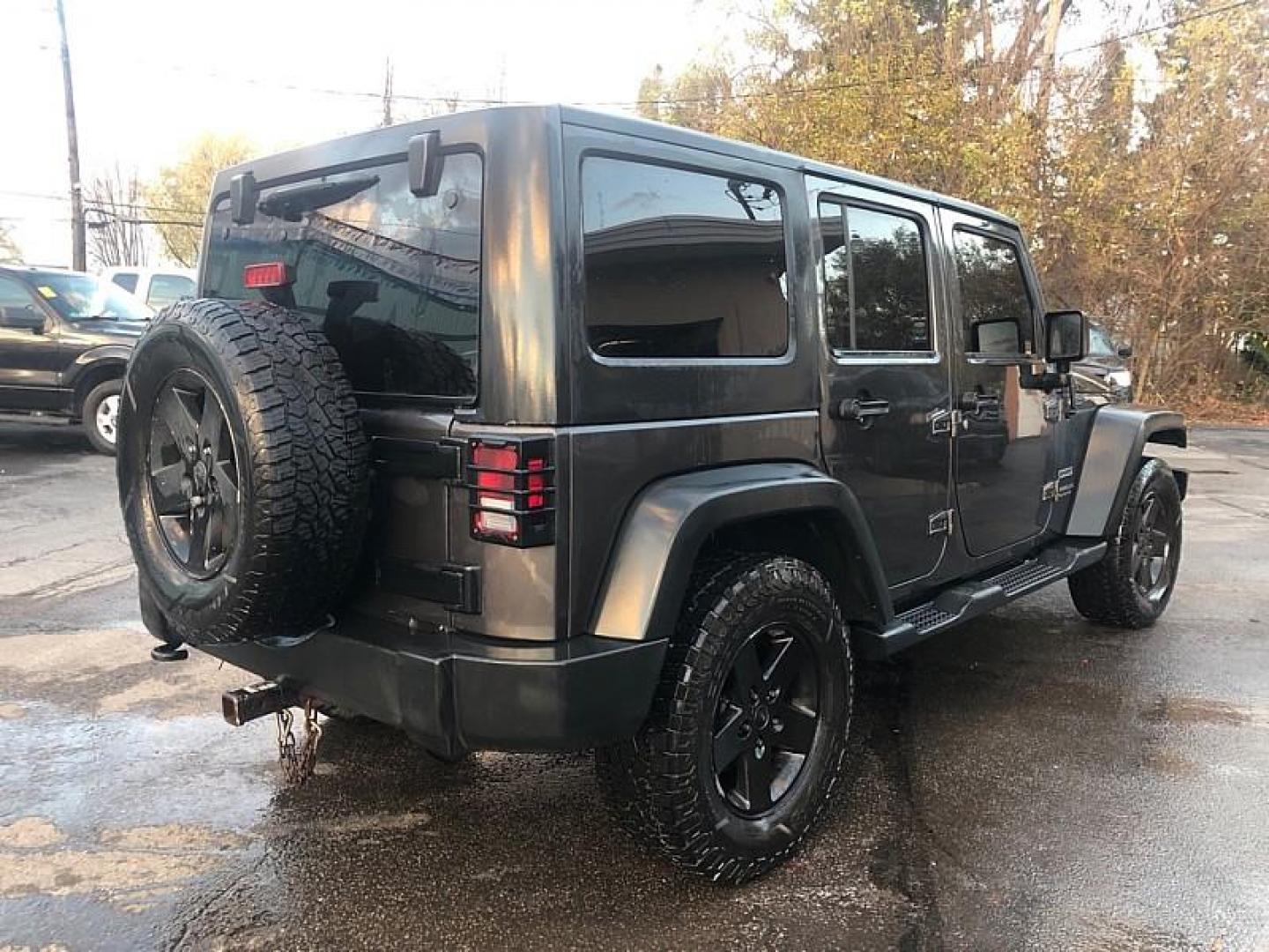 2016 GREY /BLACK Jeep Wrangler Unlimited Sport 4WD (1C4BJWDG1GL) with an 3.6L V6 DOHC 24V FFV engine, Manual 6-Spd transmission, located at 3304 Woodville Road, Northwood, OH, 43619, (419) 210-8019, 41.612694, -83.480743 - Your #1 Destination for Auto Loans and mdash;No Matter Your Credit!At our dealership, we cater to everyone and mdash;whether you have good, bad, or no credit. With hundreds of vehicles to choose from, you can easily find the perfect car, truck, or SUV that fits your needs.Get Approved Today!Visit ou - Photo#4