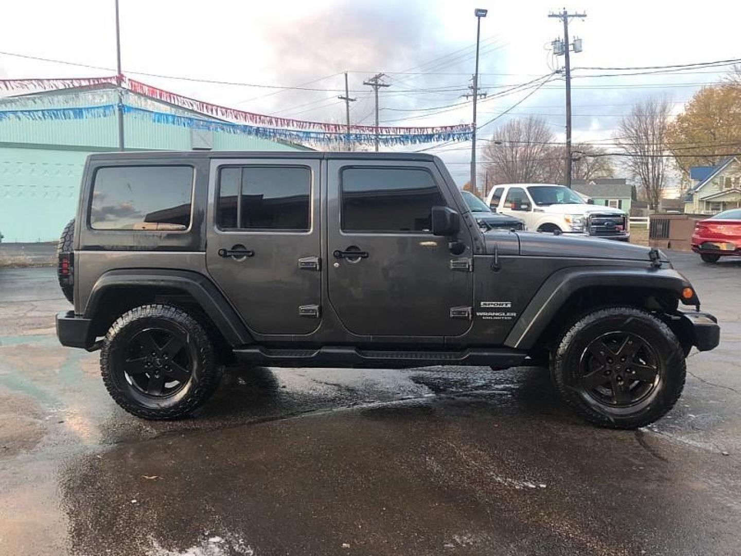 2016 GREY /BLACK Jeep Wrangler Unlimited Sport 4WD (1C4BJWDG1GL) with an 3.6L V6 DOHC 24V FFV engine, Manual 6-Spd transmission, located at 3304 Woodville Road, Northwood, OH, 43619, (419) 210-8019, 41.612694, -83.480743 - Your #1 Destination for Auto Loans and mdash;No Matter Your Credit!At our dealership, we cater to everyone and mdash;whether you have good, bad, or no credit. With hundreds of vehicles to choose from, you can easily find the perfect car, truck, or SUV that fits your needs.Get Approved Today!Visit ou - Photo#5