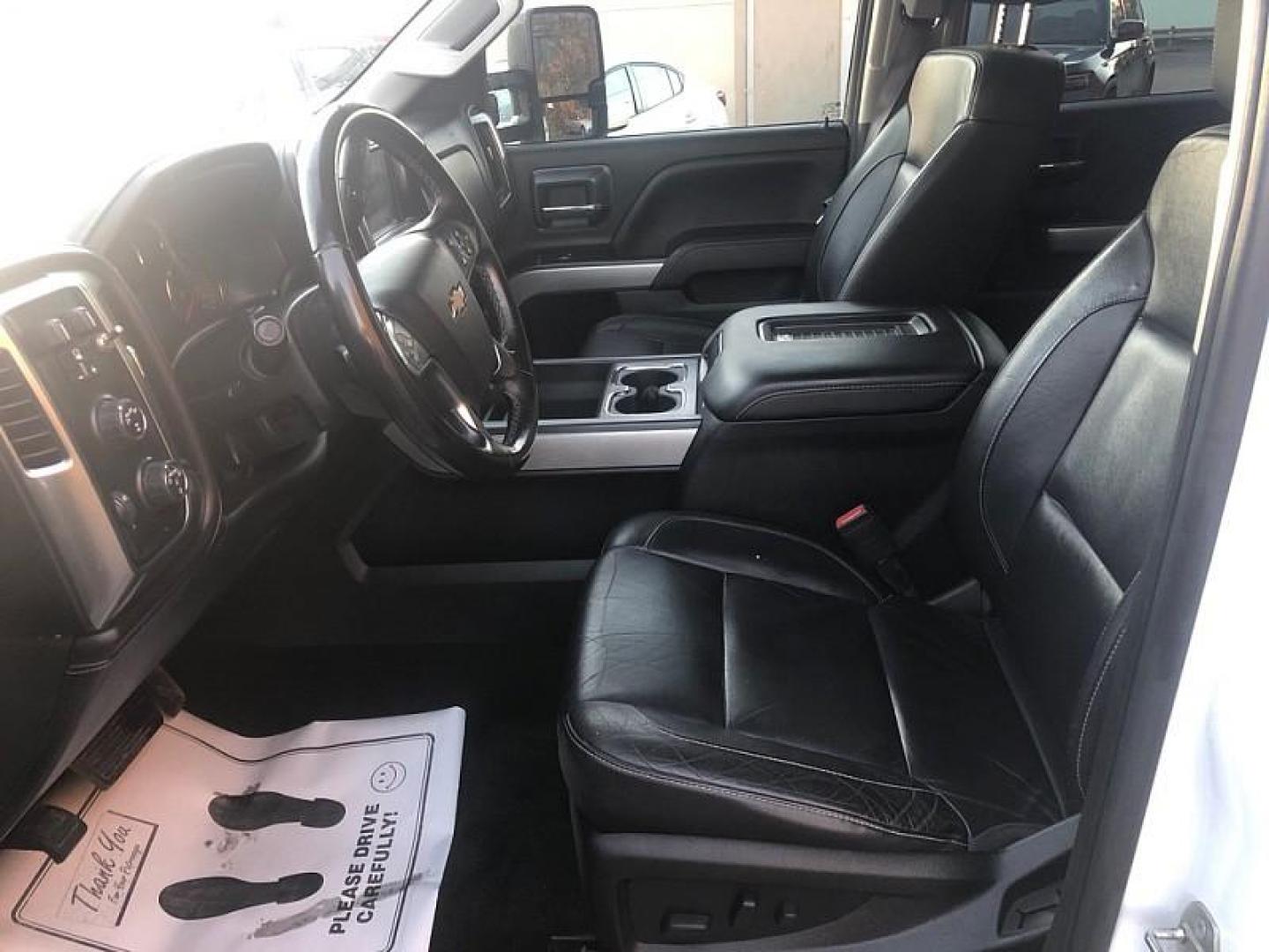 2017 WHITE /BLACK Chevrolet Silverado 1500 LTZ Crew Cab Long Box 4WD (3GCUKSECXHG) with an 5.3L V8 OHV 16V engine, 6A transmission, located at 3304 Woodville Road, Northwood, OH, 43619, (419) 210-8019, 41.612694, -83.480743 - Your #1 Destination for Auto Loans and mdash;No Matter Your Credit!At our dealership, we cater to everyone and mdash;whether you have good, bad, or no credit. With hundreds of vehicles to choose from, you can easily find the perfect car, truck, or SUV that fits your needs.Get Approved Today!Visit ou - Photo#9