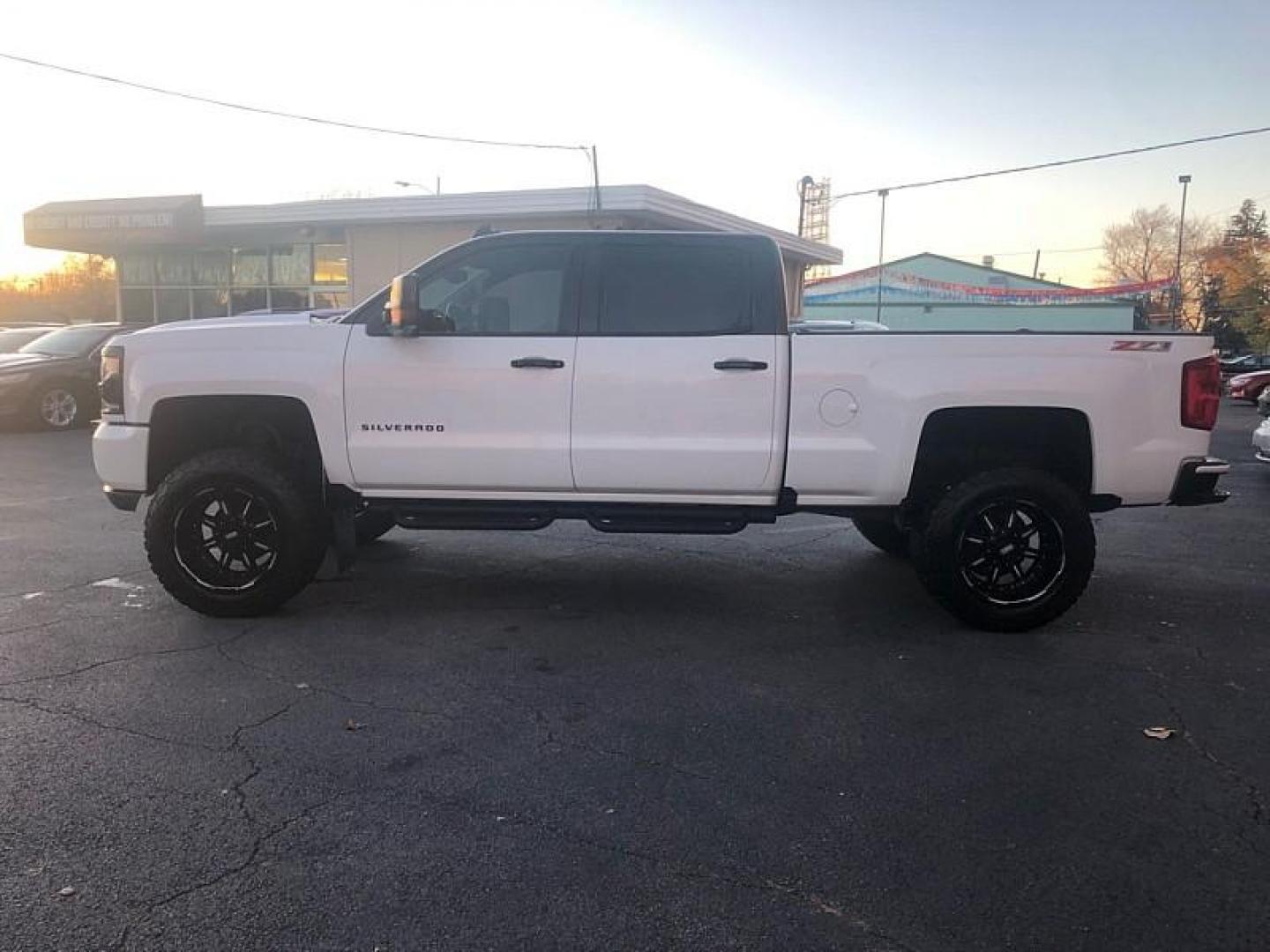 2017 WHITE /BLACK Chevrolet Silverado 1500 LTZ Crew Cab Long Box 4WD (3GCUKSECXHG) with an 5.3L V8 OHV 16V engine, 6A transmission, located at 3304 Woodville Road, Northwood, OH, 43619, (419) 210-8019, 41.612694, -83.480743 - Your #1 Destination for Auto Loans and mdash;No Matter Your Credit!At our dealership, we cater to everyone and mdash;whether you have good, bad, or no credit. With hundreds of vehicles to choose from, you can easily find the perfect car, truck, or SUV that fits your needs.Get Approved Today!Visit ou - Photo#1