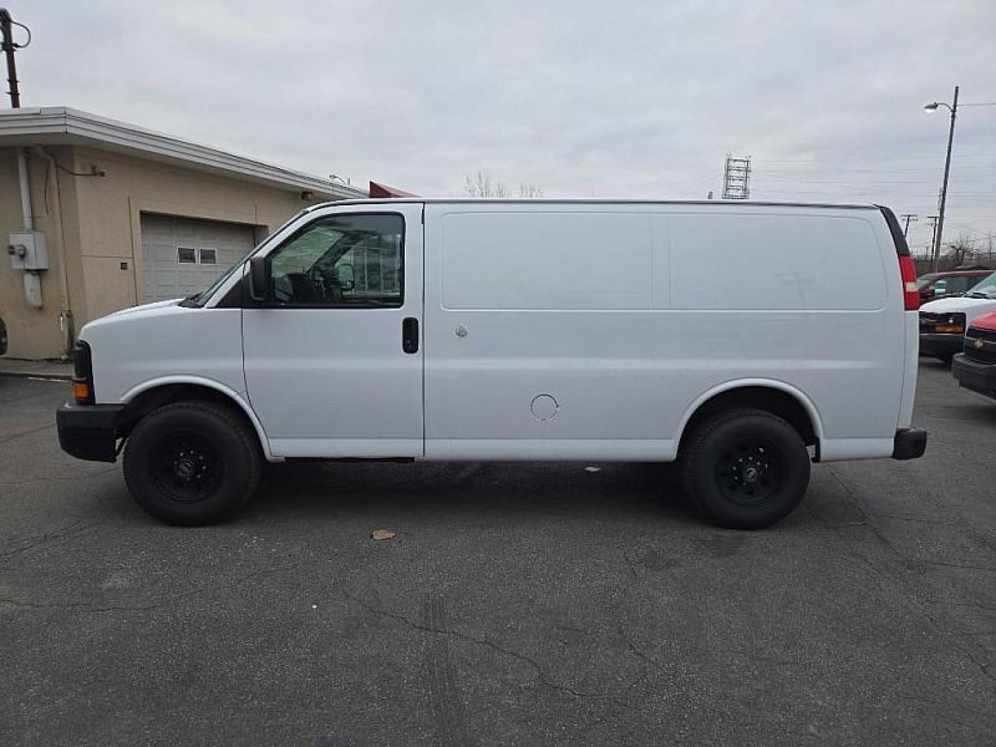 2015 WHITE /GRAY Chevrolet Express 2500 Cargo FFV (1GCWGFCF8F1) with an 4.8L V8 FFV engine, 6-Speed Automatic transmission, located at 3304 Woodville Road, Northwood, OH, 43619, (419) 210-8019, 41.612694, -83.480743 - Your #1 Destination for Auto Loans and mdash;No Matter Your Credit!At our dealership, we believe everyone deserves the opportunity to drive their dream car and mdash;whether you have good credit, bad credit, or no credit at all. With a wide selection of hundreds of cars, trucks, and SUVs, you'll fin - Photo#1