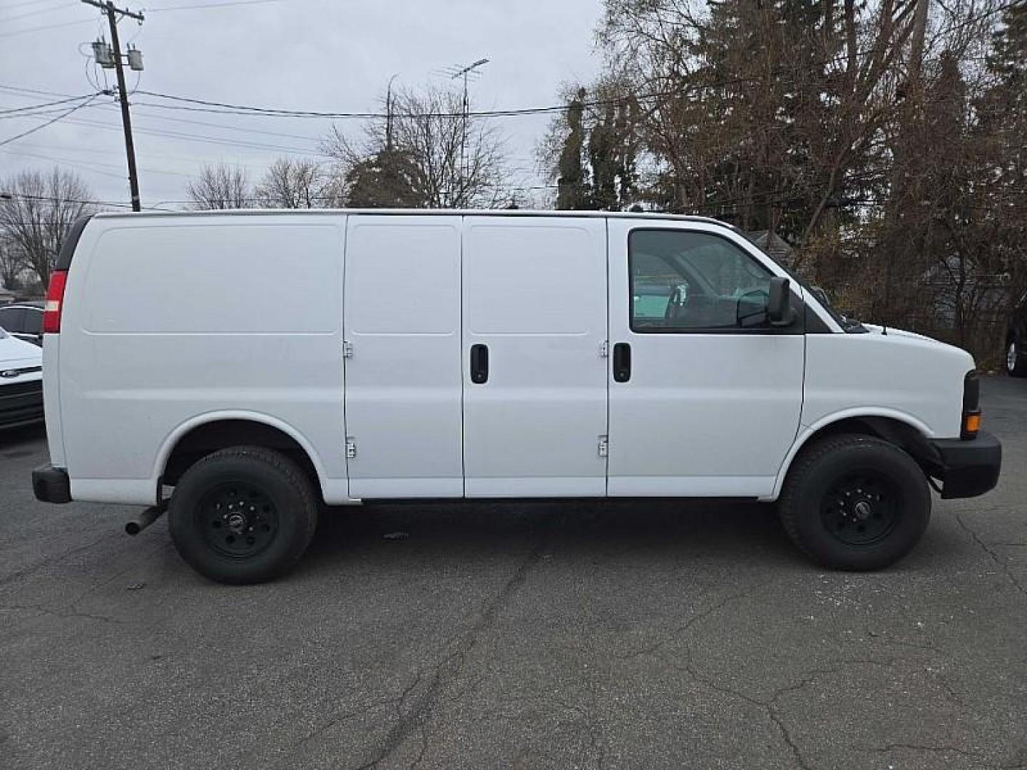 2015 WHITE /GRAY Chevrolet Express 2500 Cargo FFV (1GCWGFCF8F1) with an 4.8L V8 FFV engine, 6-Speed Automatic transmission, located at 3304 Woodville Road, Northwood, OH, 43619, (419) 210-8019, 41.612694, -83.480743 - Your #1 Destination for Auto Loans and mdash;No Matter Your Credit!At our dealership, we believe everyone deserves the opportunity to drive their dream car and mdash;whether you have good credit, bad credit, or no credit at all. With a wide selection of hundreds of cars, trucks, and SUVs, you'll fin - Photo#5