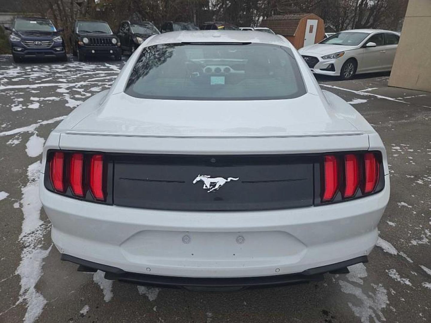 2018 WHITE /BLACK Ford Mustang EcoBoost Coupe (1FA6P8TH4J5) with an 2.3L L4 DOHC 16V engine, Auto 10-Spd SelectShft transmission, located at 3304 Woodville Road, Northwood, OH, 43619, (419) 210-8019, 41.612694, -83.480743 - Your #1 Destination for Auto Loans and mdash;No Matter Your Credit!At our dealership, we believe everyone deserves the opportunity to drive their dream car and mdash;whether you have good credit, bad credit, or no credit at all. With a wide selection of hundreds of cars, trucks, and SUVs, you'll fin - Photo#3