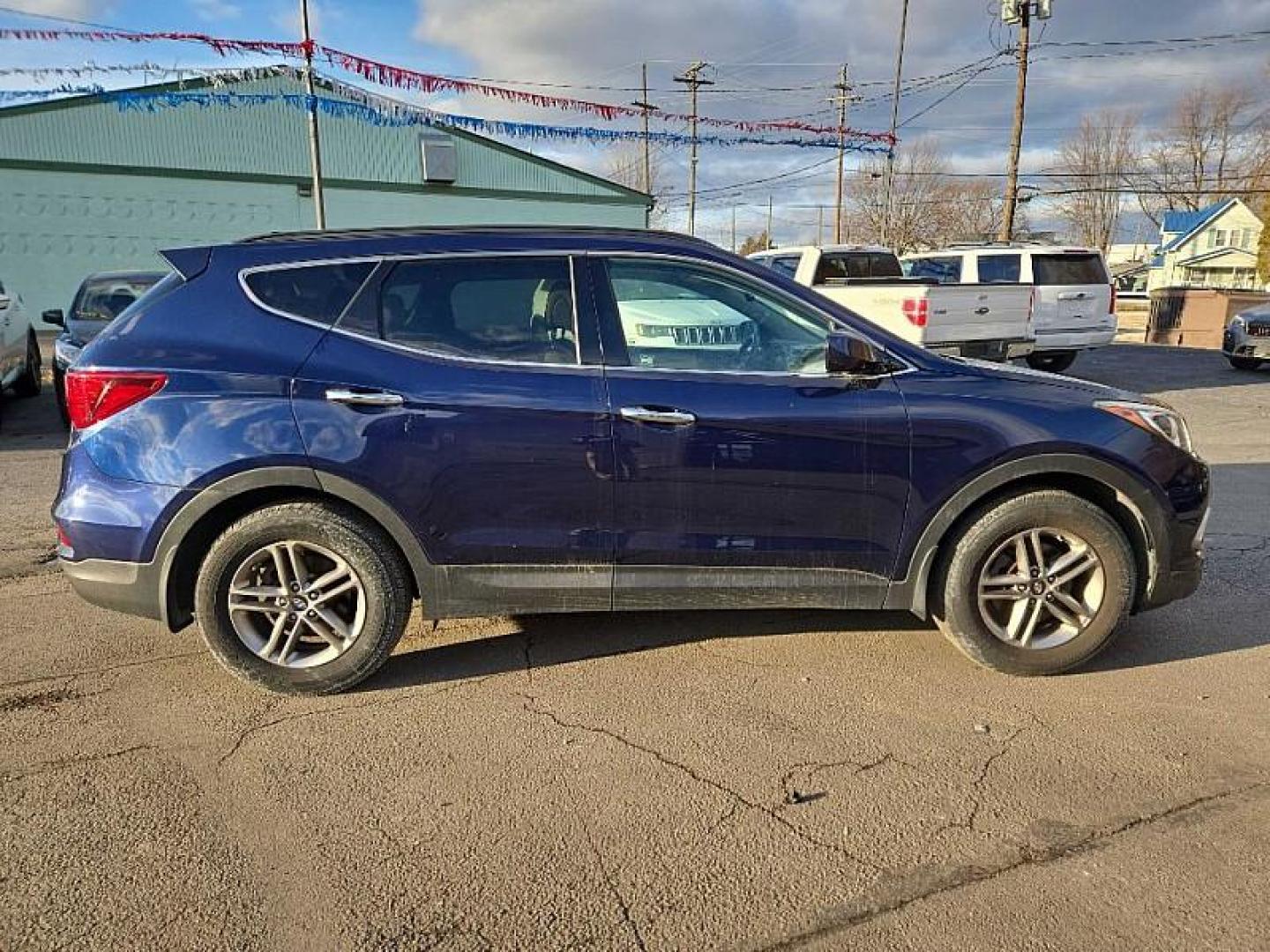 2017 BLUE /TAN/BROWN Hyundai Santa Fe Sport 2.4 FWD (5XYZU3LB3HG) with an 2.4L L4 DOHC 16V engine, 6A transmission, located at 3304 Woodville Road, Northwood, OH, 43619, (419) 210-8019, 41.612694, -83.480743 - Your #1 Destination for Auto Loans and mdash;No Matter Your Credit!At our dealership, we believe everyone deserves the opportunity to drive their dream car and mdash;whether you have good credit, bad credit, or no credit at all. With a wide selection of hundreds of cars, trucks, and SUVs, you'll fin - Photo#5