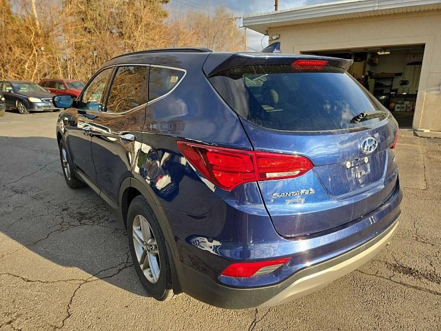 2017 BLUE /TAN/BROWN Hyundai Santa Fe Sport 2.4 FWD (5XYZU3LB3HG) with an 2.4L L4 DOHC 16V engine, 6A transmission, located at 3304 Woodville Road, Northwood, OH, 43619, (419) 210-8019, 41.612694, -83.480743 - Your #1 Destination for Auto Loans and mdash;No Matter Your Credit!At our dealership, we believe everyone deserves the opportunity to drive their dream car and mdash;whether you have good credit, bad credit, or no credit at all. With a wide selection of hundreds of cars, trucks, and SUVs, you'll fin - Photo#2