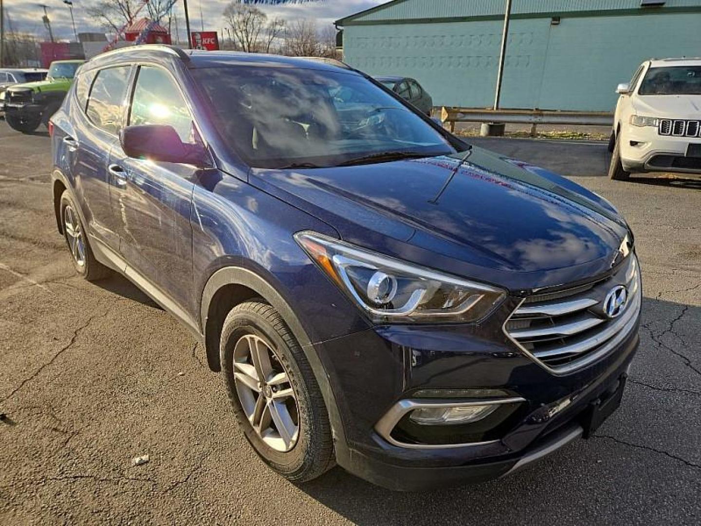 2017 BLUE /TAN/BROWN Hyundai Santa Fe Sport 2.4 FWD (5XYZU3LB3HG) with an 2.4L L4 DOHC 16V engine, 6A transmission, located at 3304 Woodville Road, Northwood, OH, 43619, (419) 210-8019, 41.612694, -83.480743 - Your #1 Destination for Auto Loans and mdash;No Matter Your Credit!At our dealership, we believe everyone deserves the opportunity to drive their dream car and mdash;whether you have good credit, bad credit, or no credit at all. With a wide selection of hundreds of cars, trucks, and SUVs, you'll fin - Photo#6