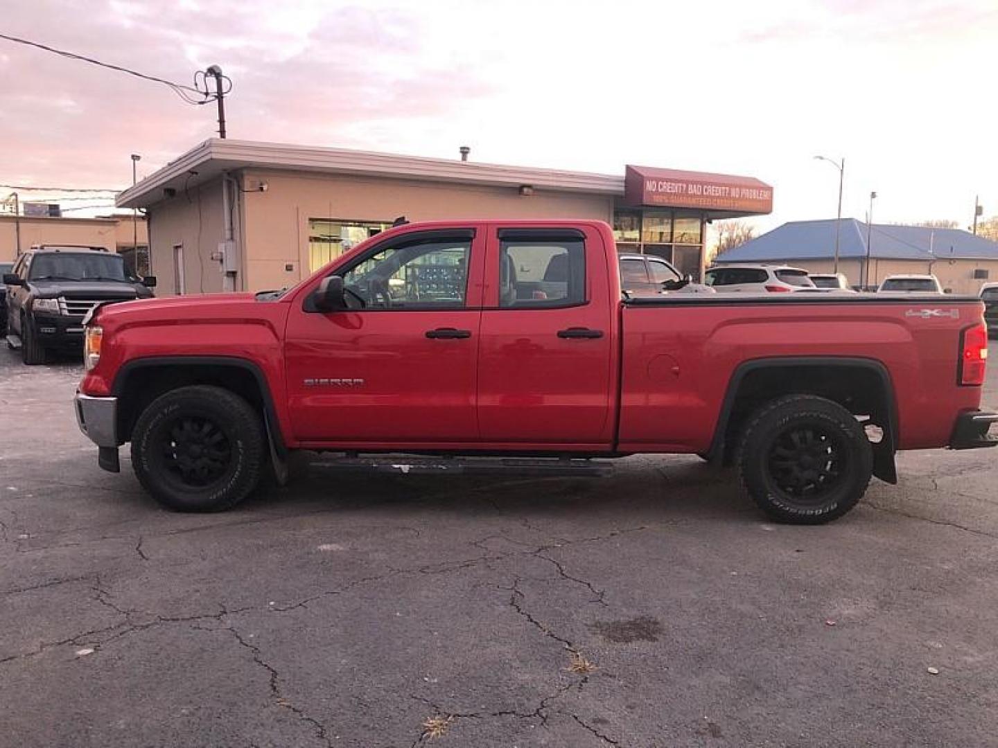 2014 Fire Red /TAN GMC Sierra 1500 Base Double Cab 4WD (1GTV2TEH6EZ) with an 4.3L V6 OHV 12V engine, 6-Speed Automatic transmission, located at 3304 Woodville Road, Northwood, OH, 43619, (419) 210-8019, 41.612694, -83.480743 - Your #1 Destination for Auto Loans and mdash;No Matter Your Credit!At our dealership, we believe everyone deserves the opportunity to drive their dream car and mdash;whether you have good credit, bad credit, or no credit at all. With a wide selection of hundreds of cars, trucks, and SUVs, you'll fin - Photo#1