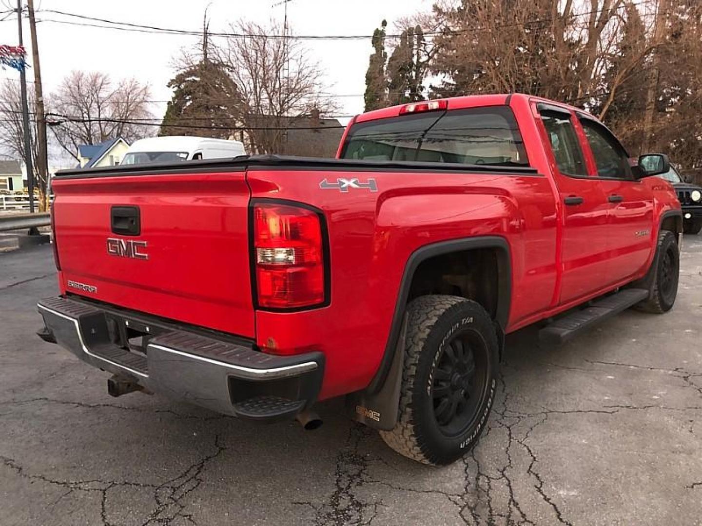 2014 Fire Red /TAN GMC Sierra 1500 Base Double Cab 4WD (1GTV2TEH6EZ) with an 4.3L V6 OHV 12V engine, 6-Speed Automatic transmission, located at 3304 Woodville Road, Northwood, OH, 43619, (419) 210-8019, 41.612694, -83.480743 - Your #1 Destination for Auto Loans and mdash;No Matter Your Credit!At our dealership, we believe everyone deserves the opportunity to drive their dream car and mdash;whether you have good credit, bad credit, or no credit at all. With a wide selection of hundreds of cars, trucks, and SUVs, you'll fin - Photo#4