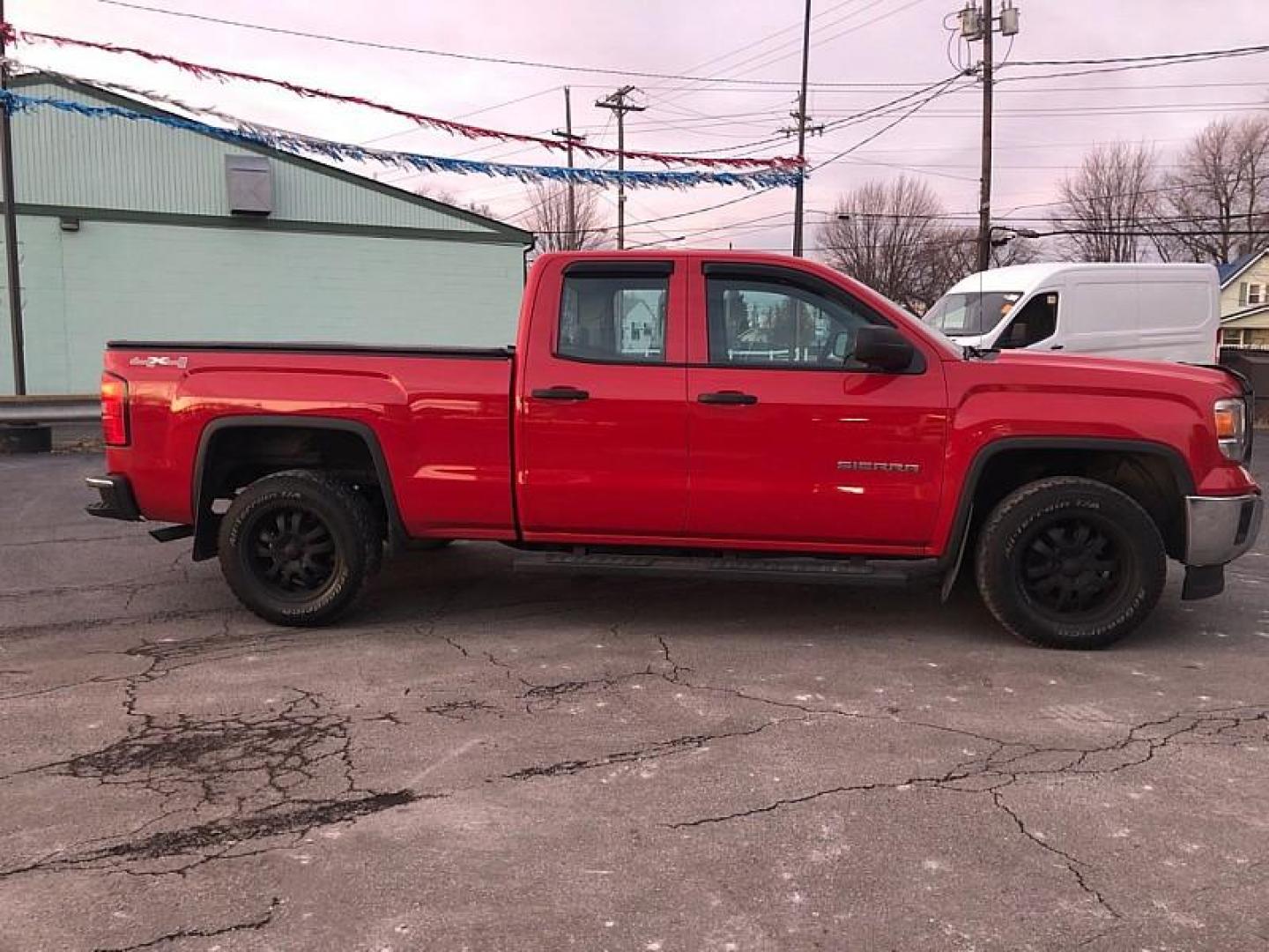 2014 Fire Red /TAN GMC Sierra 1500 Base Double Cab 4WD (1GTV2TEH6EZ) with an 4.3L V6 OHV 12V engine, 6-Speed Automatic transmission, located at 3304 Woodville Road, Northwood, OH, 43619, (419) 210-8019, 41.612694, -83.480743 - Your #1 Destination for Auto Loans and mdash;No Matter Your Credit!At our dealership, we believe everyone deserves the opportunity to drive their dream car and mdash;whether you have good credit, bad credit, or no credit at all. With a wide selection of hundreds of cars, trucks, and SUVs, you'll fin - Photo#5