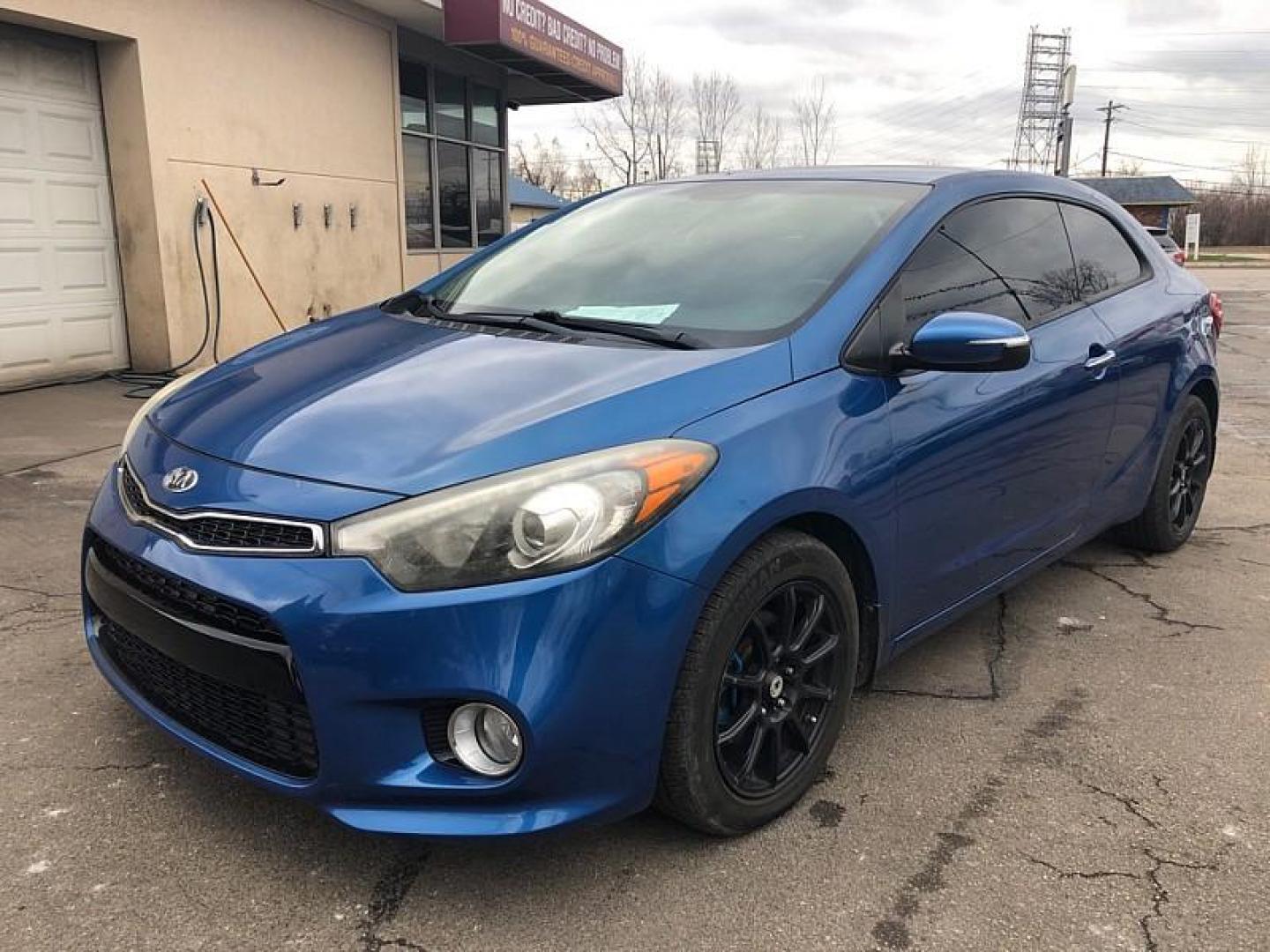 2014 BLUE /BLACK Kia Forte Koup EX (KNAFX6A89E5) with an 2.0L L4 DOHC 16V engine, 6-Speed Automatic transmission, located at 3304 Woodville Road, Northwood, OH, 43619, (419) 210-8019, 41.612694, -83.480743 - Your #1 Destination for Auto Loans and mdash;No Matter Your Credit!At our dealership, we believe everyone deserves the opportunity to drive their dream car and mdash;whether you have good credit, bad credit, or no credit at all. With a wide selection of hundreds of cars, trucks, and SUVs, you'll fin - Photo#0