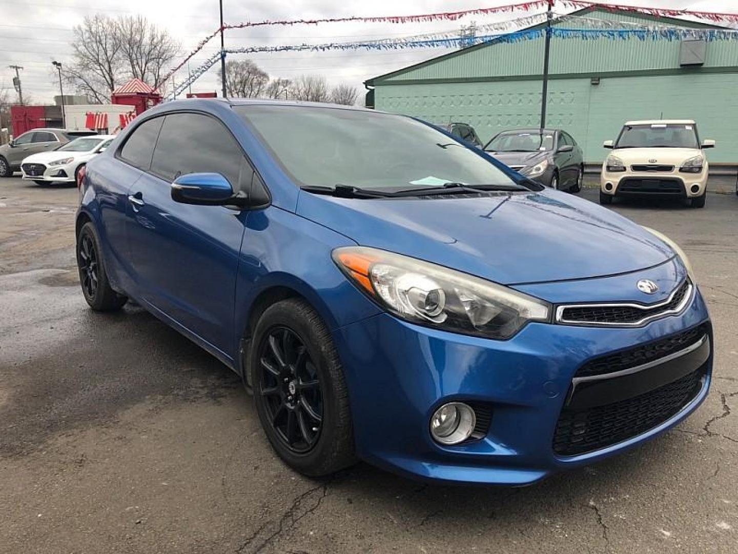 2014 BLUE /BLACK Kia Forte Koup EX (KNAFX6A89E5) with an 2.0L L4 DOHC 16V engine, 6-Speed Automatic transmission, located at 3304 Woodville Road, Northwood, OH, 43619, (419) 210-8019, 41.612694, -83.480743 - Your #1 Destination for Auto Loans and mdash;No Matter Your Credit!At our dealership, we believe everyone deserves the opportunity to drive their dream car and mdash;whether you have good credit, bad credit, or no credit at all. With a wide selection of hundreds of cars, trucks, and SUVs, you'll fin - Photo#6