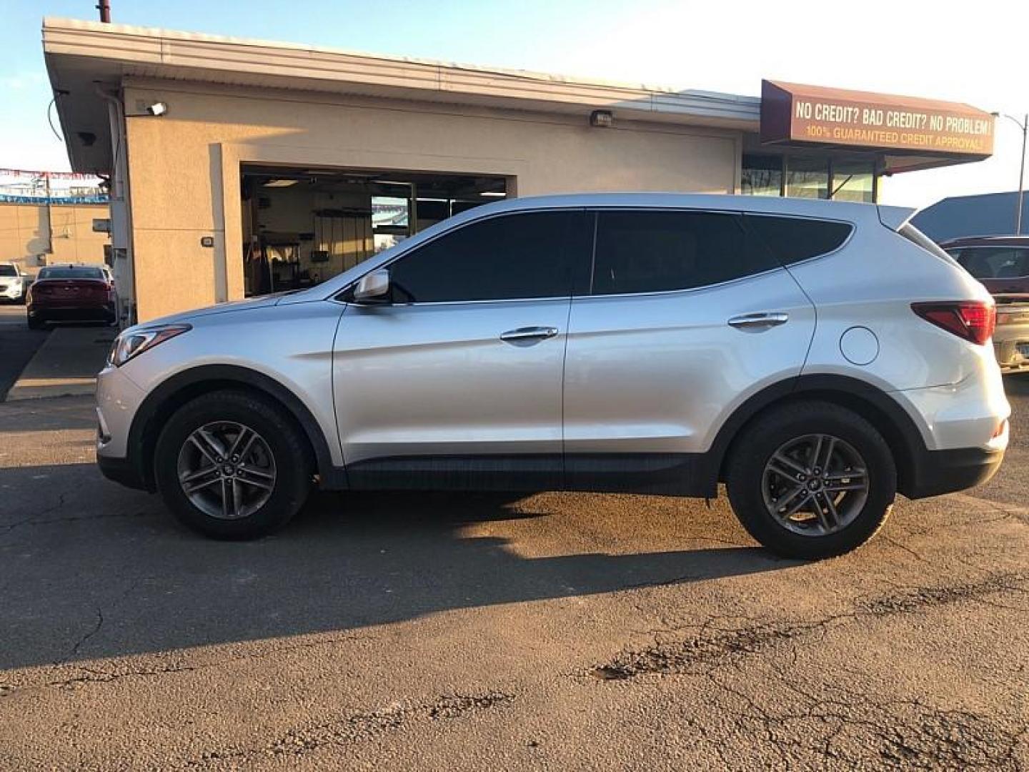 2018 SILVER /TAN Hyundai Santa Fe Sport 2.4 AWD (5XYZTDLB4JG) with an 2.4L L4 DOHC 16V engine, 6A transmission, located at 3304 Woodville Road, Northwood, OH, 43619, (419) 210-8019, 41.612694, -83.480743 - Your #1 Destination for Auto Loans and mdash;No Matter Your Credit!At our dealership, we believe everyone deserves the opportunity to drive their dream car and mdash;whether you have good credit, bad credit, or no credit at all. With a wide selection of hundreds of cars, trucks, and SUVs, you'll fin - Photo#1