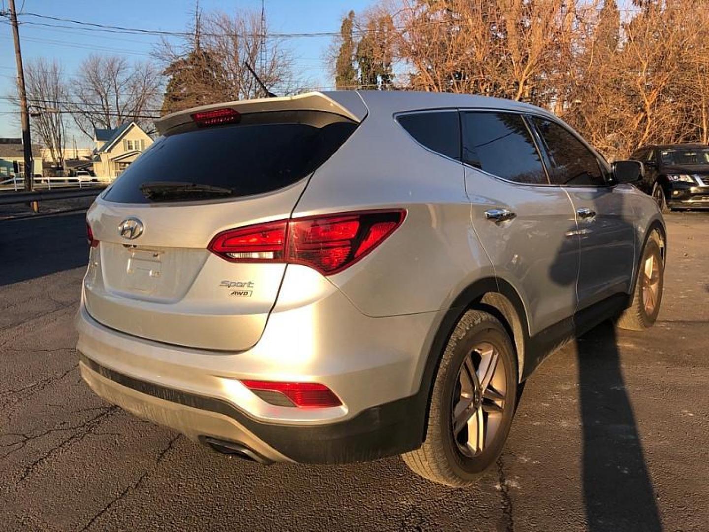 2018 SILVER /TAN Hyundai Santa Fe Sport 2.4 AWD (5XYZTDLB4JG) with an 2.4L L4 DOHC 16V engine, 6A transmission, located at 3304 Woodville Road, Northwood, OH, 43619, (419) 210-8019, 41.612694, -83.480743 - Your #1 Destination for Auto Loans and mdash;No Matter Your Credit!At our dealership, we believe everyone deserves the opportunity to drive their dream car and mdash;whether you have good credit, bad credit, or no credit at all. With a wide selection of hundreds of cars, trucks, and SUVs, you'll fin - Photo#4