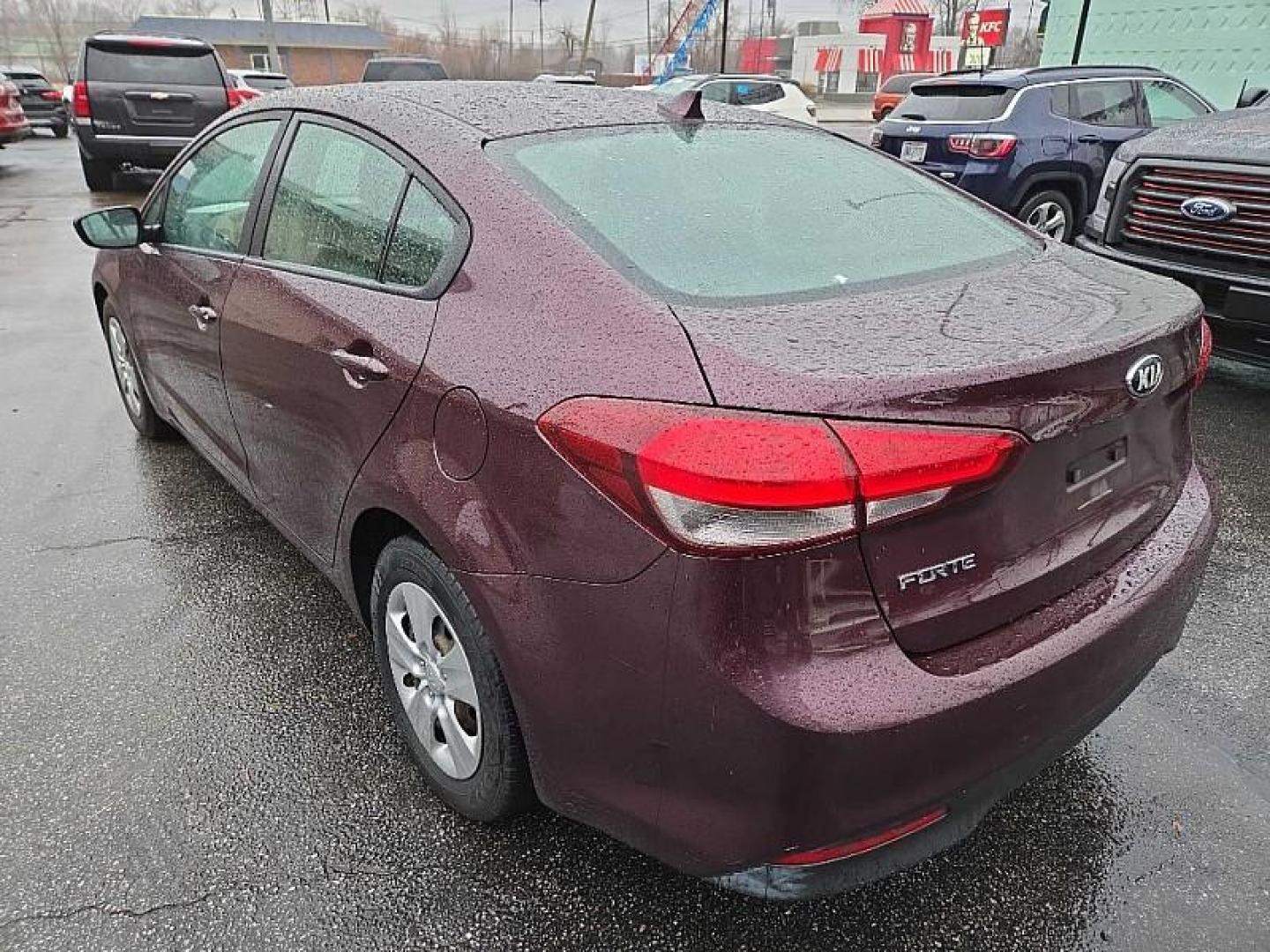 2018 RED /BLACK Kia Forte LX 6M (3KPFK4A76JE) with an 2.0L L4 DOHC 16V engine, 6M transmission, located at 3304 Woodville Road, Northwood, OH, 43619, (419) 210-8019, 41.612694, -83.480743 - Your #1 Destination for Auto Loans and mdash;No Matter Your Credit!At our dealership, we believe everyone deserves the opportunity to drive their dream car and mdash;whether you have good credit, bad credit, or no credit at all. With a wide selection of hundreds of cars, trucks, and SUVs, you'll fin - Photo#2