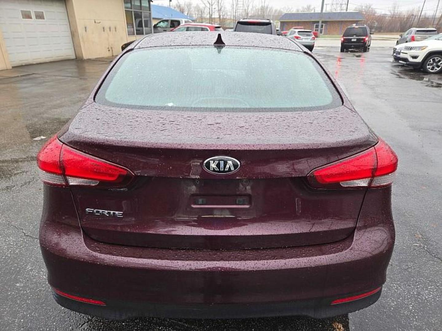 2018 RED /BLACK Kia Forte LX 6M (3KPFK4A76JE) with an 2.0L L4 DOHC 16V engine, 6M transmission, located at 3304 Woodville Road, Northwood, OH, 43619, (419) 210-8019, 41.612694, -83.480743 - Your #1 Destination for Auto Loans and mdash;No Matter Your Credit!At our dealership, we believe everyone deserves the opportunity to drive their dream car and mdash;whether you have good credit, bad credit, or no credit at all. With a wide selection of hundreds of cars, trucks, and SUVs, you'll fin - Photo#3