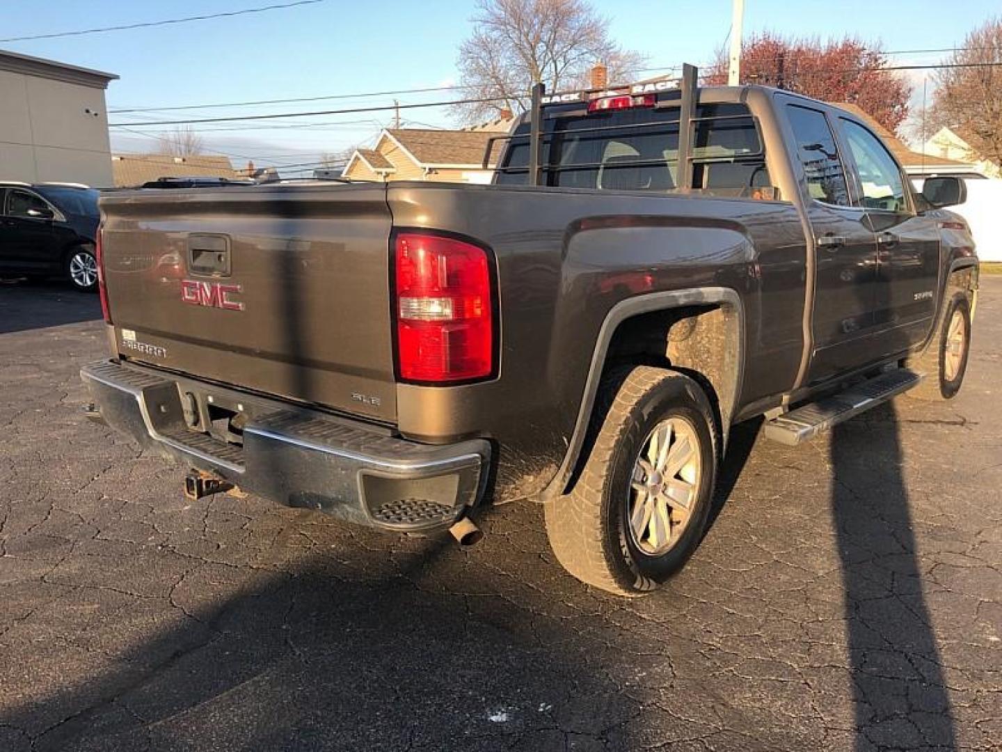 2013 TAN /BLACK GMC Sierra 1500 SLE Ext. Cab 4WD (1GTV2UEC9EZ) with an 5.3L V8 OHV 16V engine, 6-Speed Automatic transmission, located at 3304 Woodville Road, Northwood, OH, 43619, (419) 210-8019, 41.612694, -83.480743 - Your #1 Destination for Auto Loans and mdash;No Matter Your Credit!At our dealership, we believe everyone deserves the opportunity to drive their dream car and mdash;whether you have good credit, bad credit, or no credit at all. With a wide selection of hundreds of cars, trucks, and SUVs, you'll fin - Photo#4