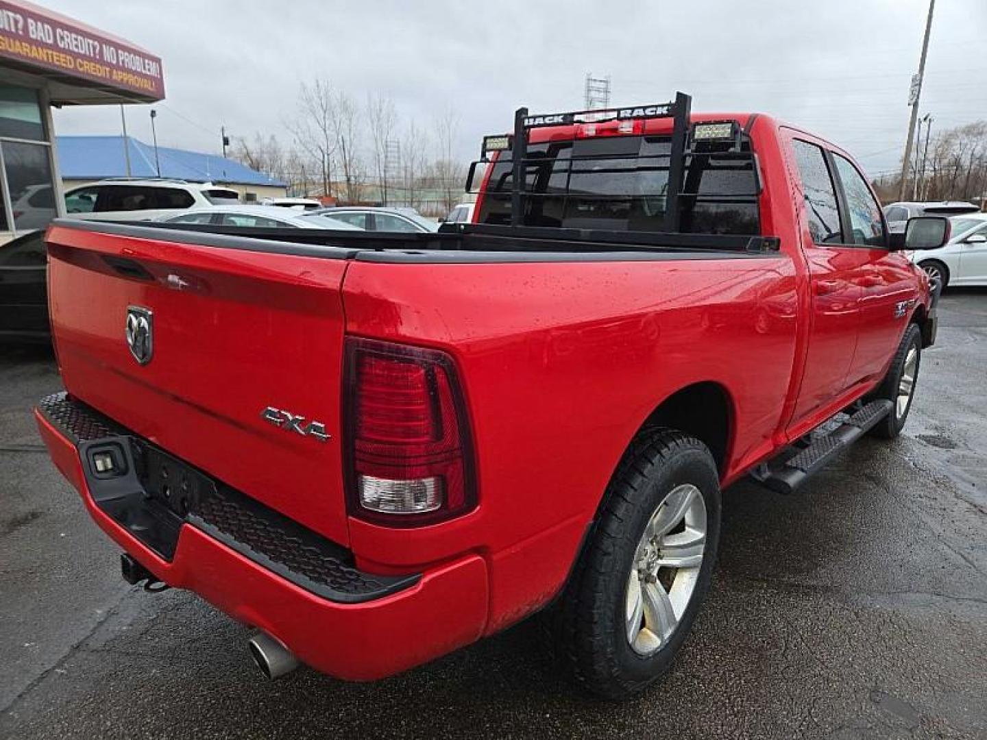 2015 RED /BLACK RAM 1500 Sport Quad Cab 4WD (1C6RR7HT0FS) with an 5.7L V8 OHV 16V engine, 6-Speed Automatic transmission, located at 3304 Woodville Road, Northwood, OH, 43619, (419) 210-8019, 41.612694, -83.480743 - Your #1 Destination for Auto Loans and mdash;No Matter Your Credit!At our dealership, we believe everyone deserves the opportunity to drive their dream car and mdash;whether you have good credit, bad credit, or no credit at all. With a wide selection of hundreds of cars, trucks, and SUVs, you'll fin - Photo#4