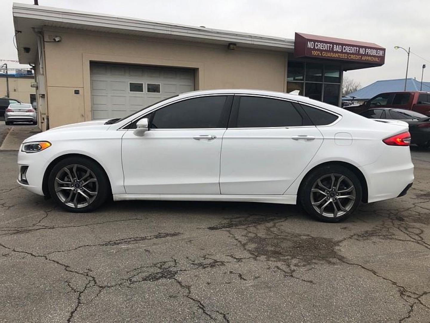 2020 WHITE /BLACK Ford Fusion Hybrid Titanium (3FA6P0RU9LR) with an 2.0L L4 DOHC 16V HYBRID engine, CVT transmission, located at 3304 Woodville Road, Northwood, OH, 43619, (419) 210-8019, 41.612694, -83.480743 - Your #1 Destination for Auto Loans and mdash;No Matter Your Credit!At our dealership, we believe everyone deserves the opportunity to drive their dream car and mdash;whether you have good credit, bad credit, or no credit at all. With a wide selection of hundreds of cars, trucks, and SUVs, you'll fin - Photo#1