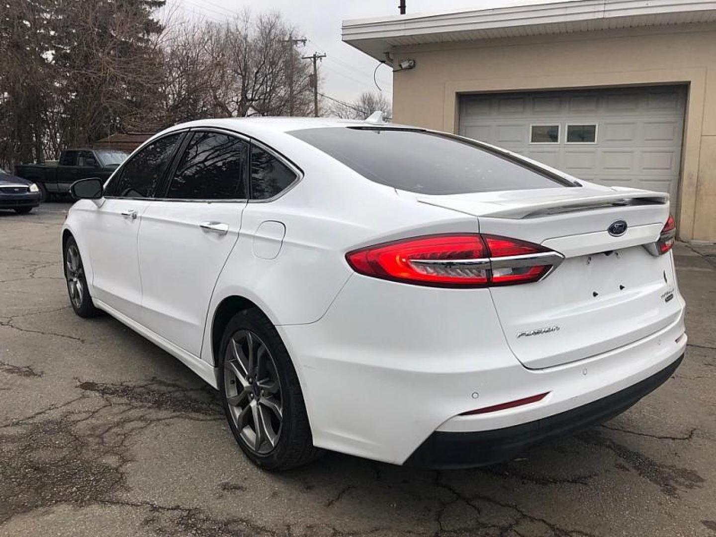 2020 WHITE /BLACK Ford Fusion Hybrid Titanium (3FA6P0RU9LR) with an 2.0L L4 DOHC 16V HYBRID engine, CVT transmission, located at 3304 Woodville Road, Northwood, OH, 43619, (419) 210-8019, 41.612694, -83.480743 - Your #1 Destination for Auto Loans and mdash;No Matter Your Credit!At our dealership, we believe everyone deserves the opportunity to drive their dream car and mdash;whether you have good credit, bad credit, or no credit at all. With a wide selection of hundreds of cars, trucks, and SUVs, you'll fin - Photo#2