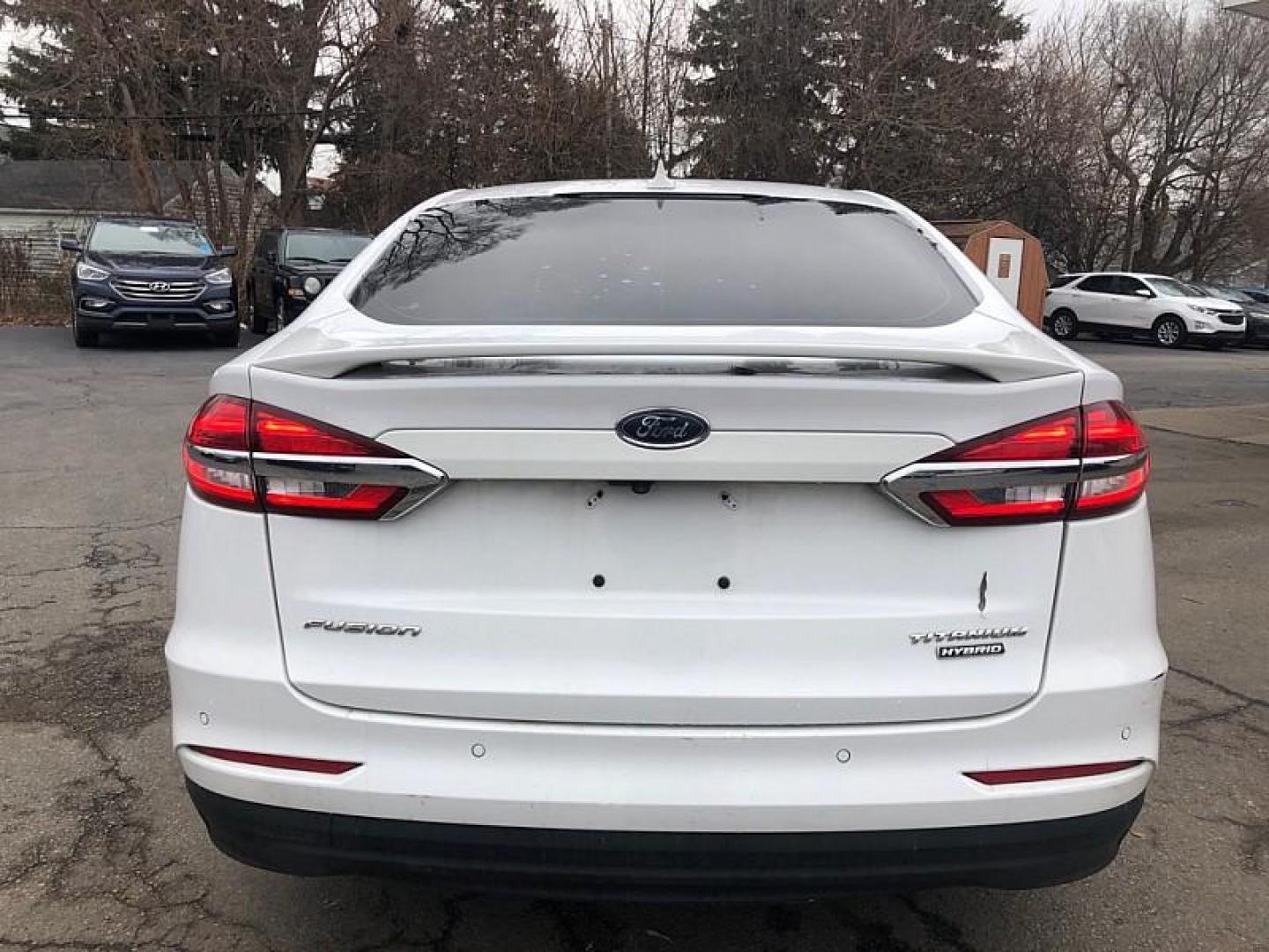 2020 WHITE /BLACK Ford Fusion Hybrid Titanium (3FA6P0RU9LR) with an 2.0L L4 DOHC 16V HYBRID engine, CVT transmission, located at 3304 Woodville Road, Northwood, OH, 43619, (419) 210-8019, 41.612694, -83.480743 - Your #1 Destination for Auto Loans and mdash;No Matter Your Credit!At our dealership, we believe everyone deserves the opportunity to drive their dream car and mdash;whether you have good credit, bad credit, or no credit at all. With a wide selection of hundreds of cars, trucks, and SUVs, you'll fin - Photo#3