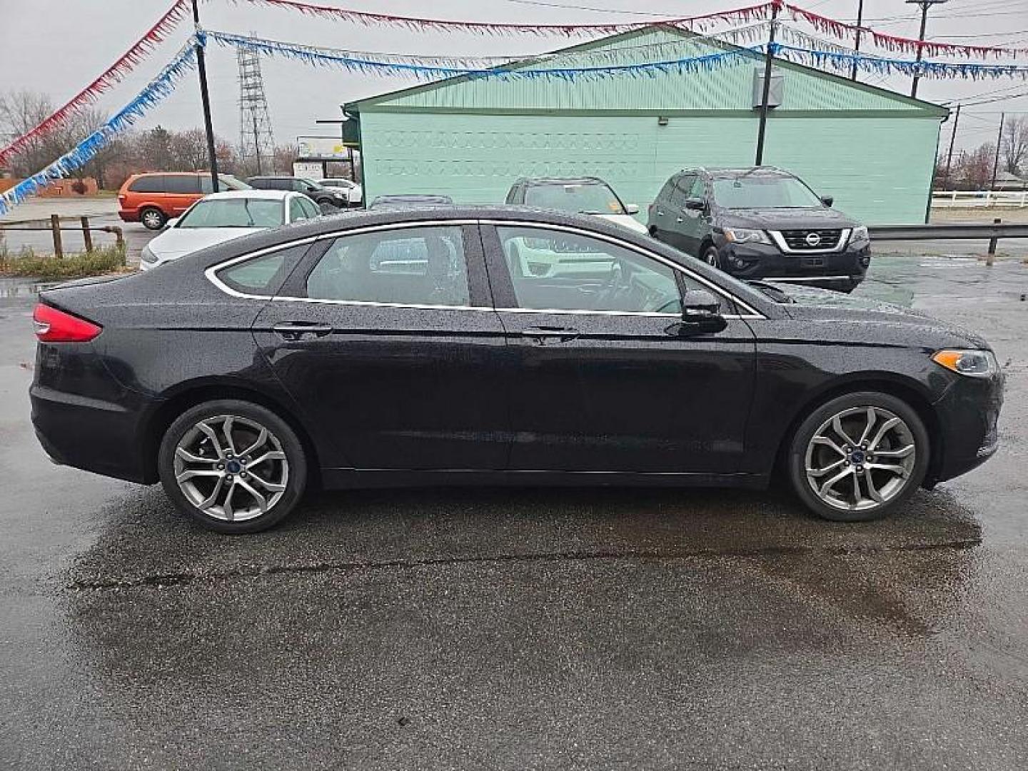 2019 BLACK /BLACK Ford Fusion SEL (3FA6P0CD3KR) with an 1.5L L4 DOHC 16V engine, 6A transmission, located at 3304 Woodville Road, Northwood, OH, 43619, (419) 210-8019, 41.612694, -83.480743 - Your #1 Destination for Auto Loans and mdash;No Matter Your Credit!At our dealership, we believe everyone deserves the opportunity to drive their dream car and mdash;whether you have good credit, bad credit, or no credit at all. With a wide selection of hundreds of cars, trucks, and SUVs, you'll fin - Photo#3