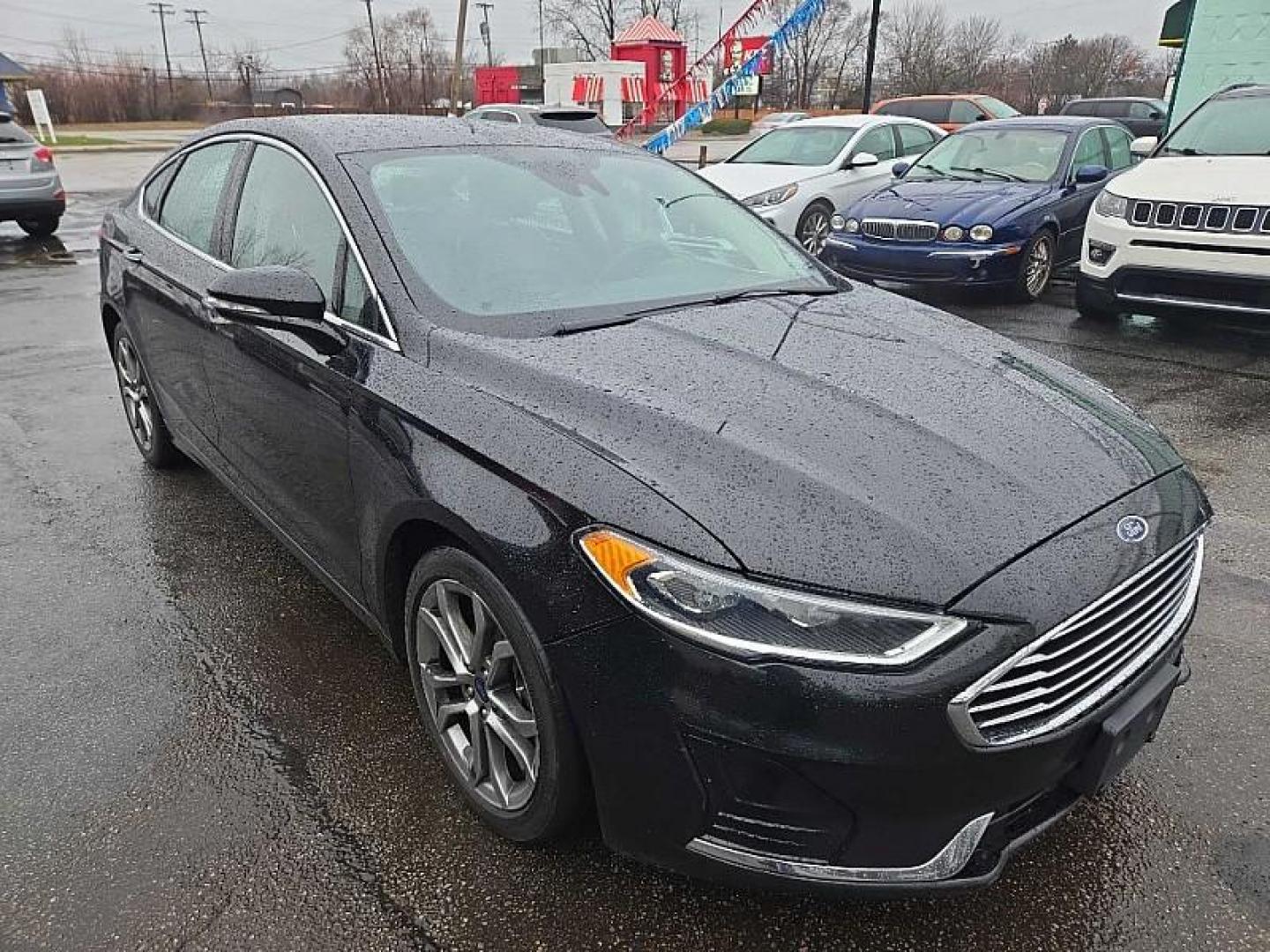 2019 BLACK /BLACK Ford Fusion SEL (3FA6P0CD3KR) with an 1.5L L4 DOHC 16V engine, 6A transmission, located at 3304 Woodville Road, Northwood, OH, 43619, (419) 210-8019, 41.612694, -83.480743 - Your #1 Destination for Auto Loans and mdash;No Matter Your Credit!At our dealership, we believe everyone deserves the opportunity to drive their dream car and mdash;whether you have good credit, bad credit, or no credit at all. With a wide selection of hundreds of cars, trucks, and SUVs, you'll fin - Photo#4