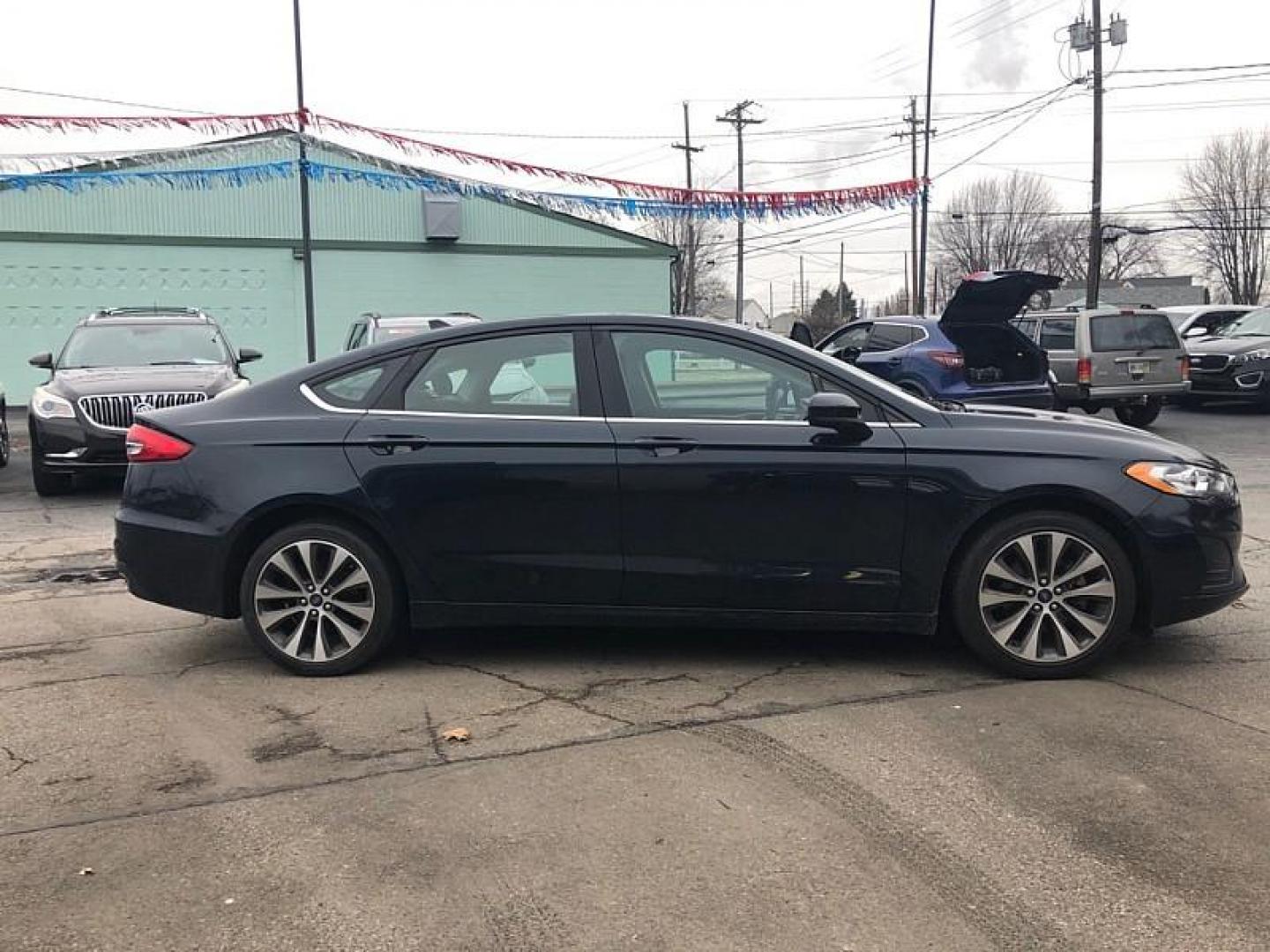 2020 BLUE Ford Fusion SE AWD (3FA6P0T93LR) with an 2.0L L4 DOHC 16V engine, 6A transmission, located at 3304 Woodville Road, Northwood, OH, 43619, (419) 210-8019, 41.612694, -83.480743 - Your #1 Destination for Auto Loans and mdash;No Matter Your Credit!At our dealership, we believe everyone deserves the opportunity to drive their dream car and mdash;whether you have good credit, bad credit, or no credit at all. With a wide selection of hundreds of cars, trucks, and SUVs, you'll fin - Photo#5