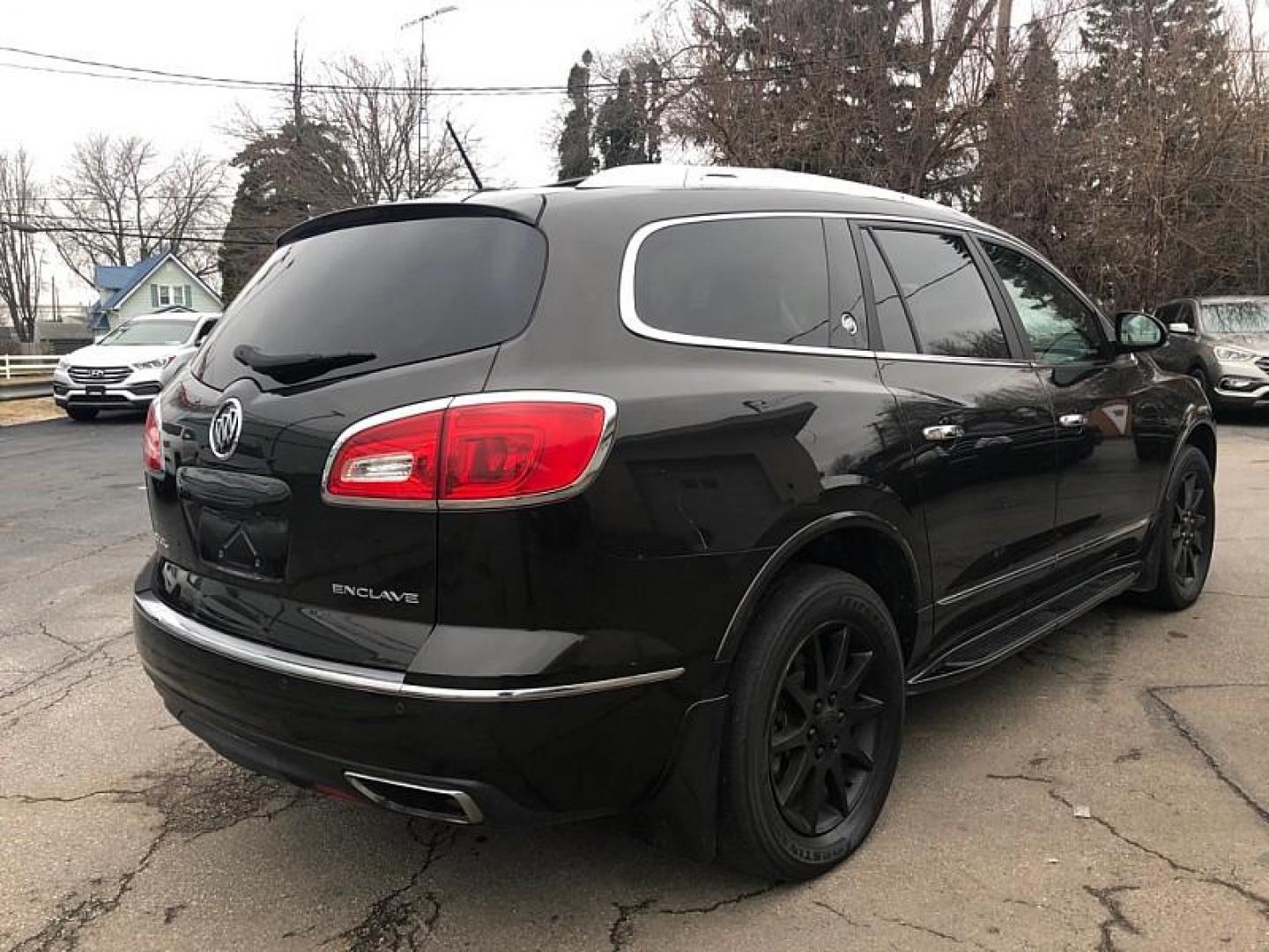 2014 GRAY /BROWN Buick Enclave Leather FWD (5GAKRBKD7EJ) with an 3.6L V6 DOHC 24V engine, 6-Speed Automatic Overdrive transmission, located at 3304 Woodville Road, Northwood, OH, 43619, (419) 210-8019, 41.612694, -83.480743 - Your #1 Destination for Auto Loans and mdash;No Matter Your Credit!At our dealership, we believe everyone deserves the opportunity to drive their dream car and mdash;whether you have good credit, bad credit, or no credit at all. With a wide selection of hundreds of cars, trucks, and SUVs, you'll fin - Photo#4